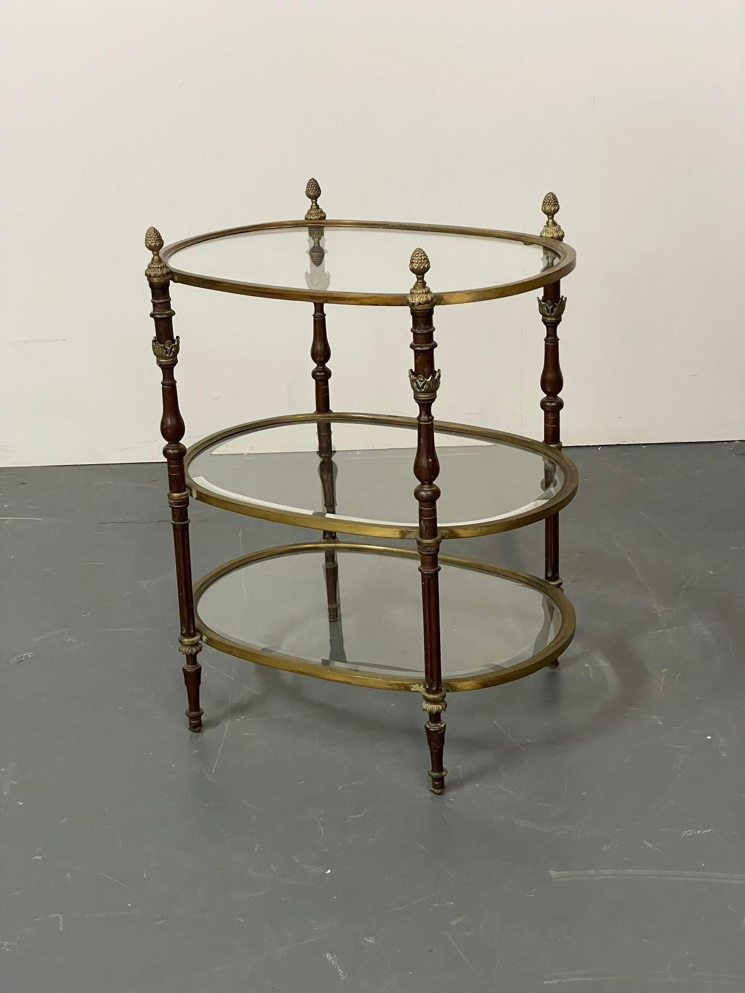 French Baques style three tier Etagere, server
A bronze 1920s diminutive server or etagere having three glass shelves cased in a bronze apron supported by finely cast bronze column form sides terminating in acorn finials. Nice think strong bronze