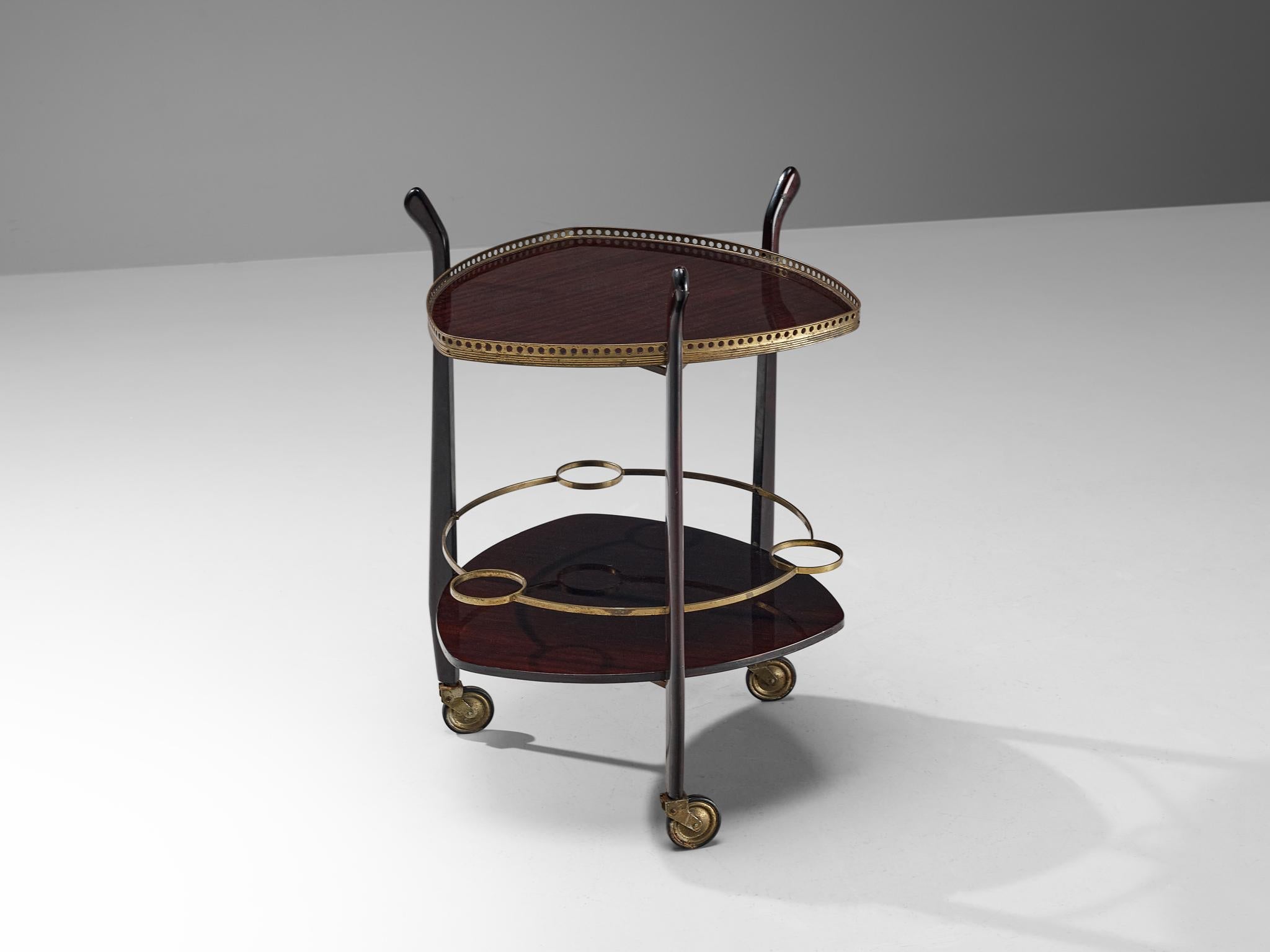 Serving trolley or bar cart, stained mahogany, brass, France, 1950s

This delicate bar cart has an open framework executed in the finest materials. The trolley contains two serving plates in stained mahogany with a gloss finish and three bottle