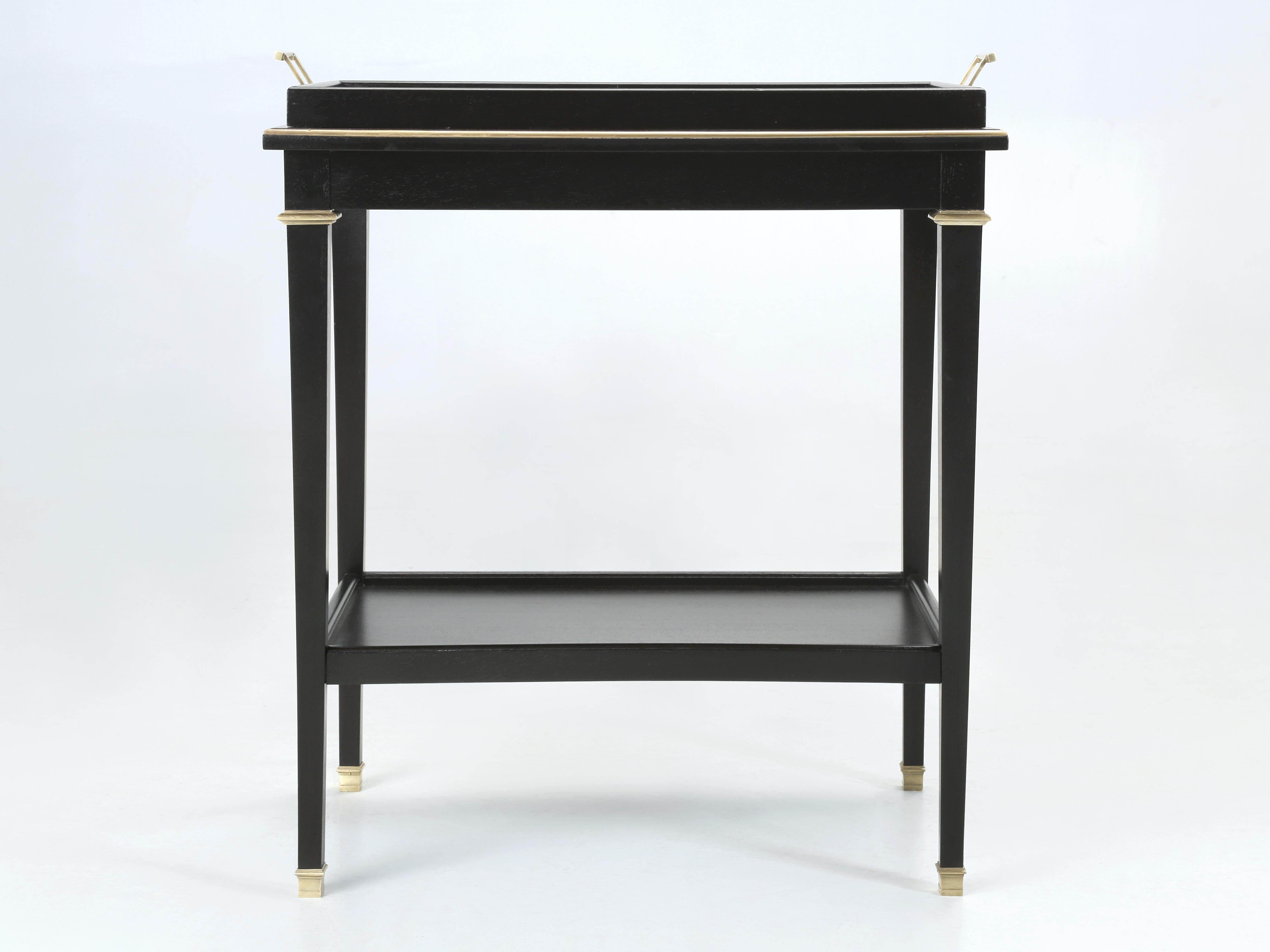 French Vintage Bar Cart or Side Table or End Table for this is a very unusual and beautifully made. Once we started stripping off the old finish and removing some of the brass trim, we began to notice that after the casters were removed it