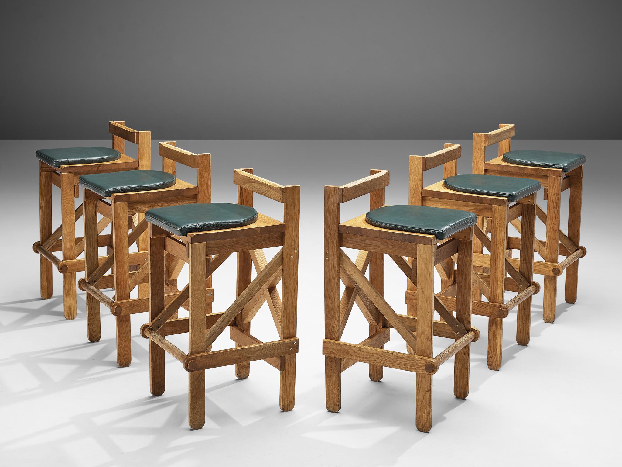 Bar stools, oak, France, 1960s

Sculptural yet natural bar stools in oak. These stools have a very elegant and complete design. Although the appearance is simplistic, all elements of a proper barstool are present. The frame with four legs shows