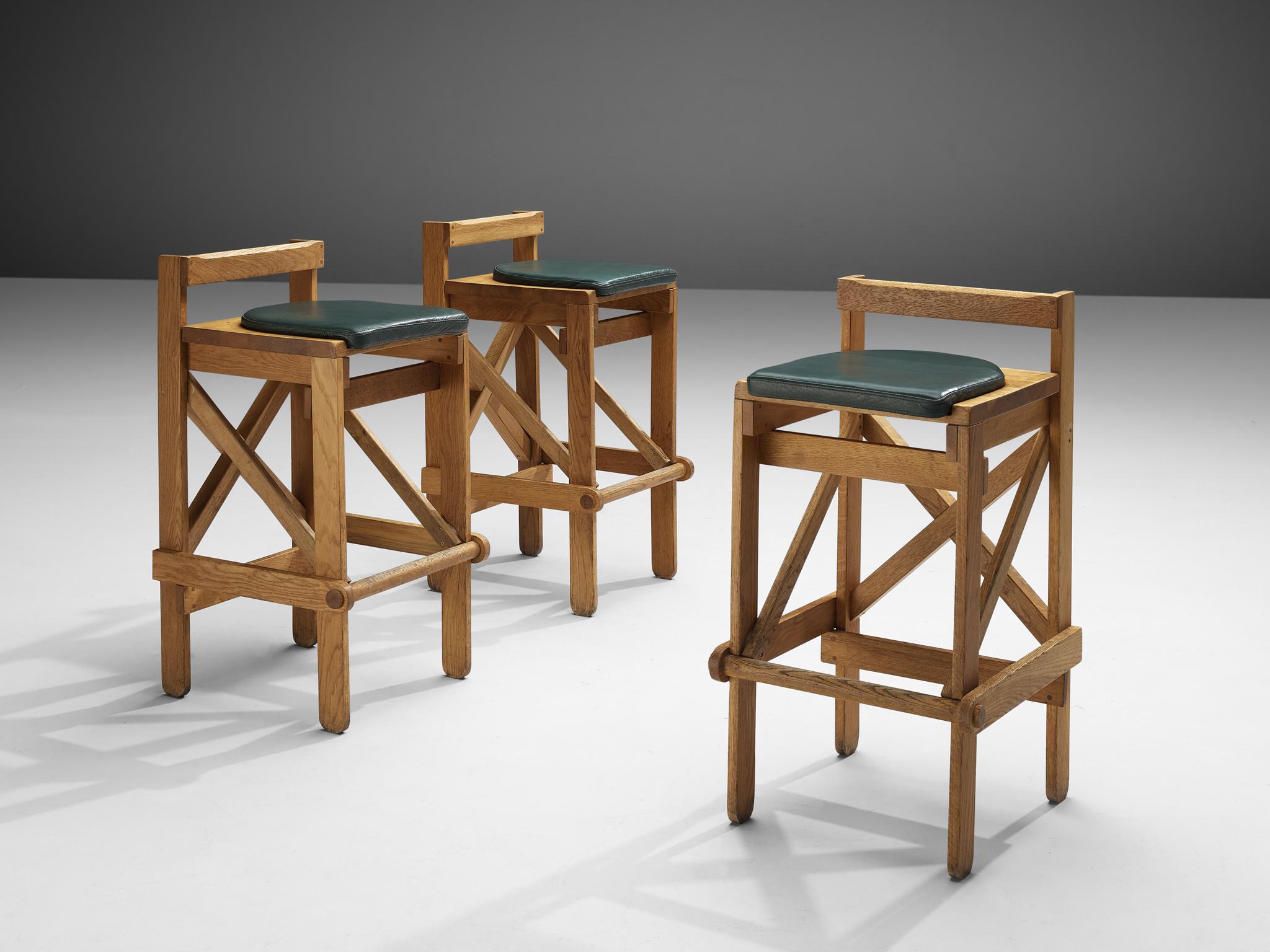 Bar stools, oak, France, 1960s

Sculptural yet natural bar stools in oak. These stools have a very elegant and complete design. Although the appearance is simplistic, all elements of a proper barstool are present. The frame with four legs shows