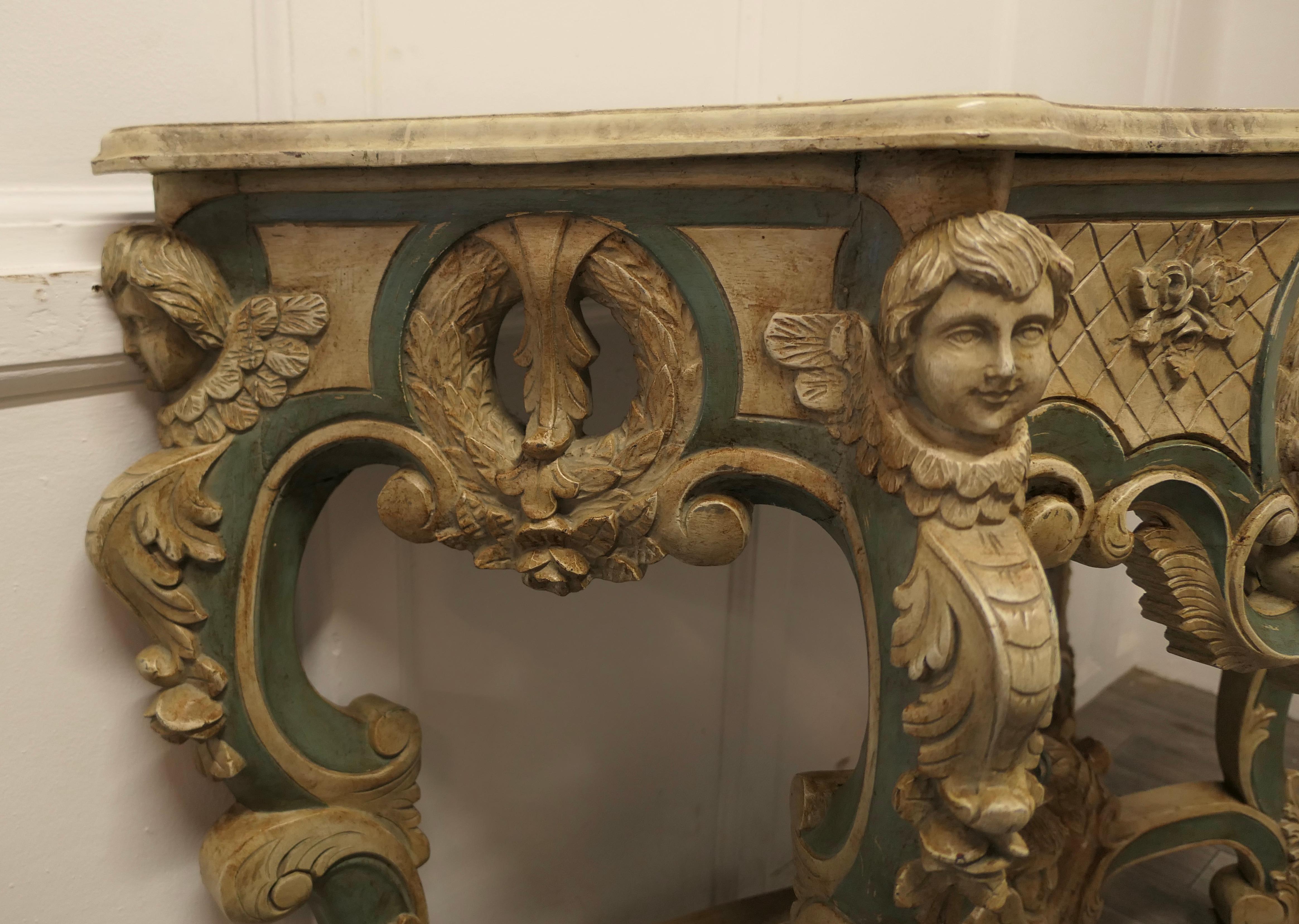 Peinture  Table console baroque française, sculptée et peinte représentant les visages d'anges en vente