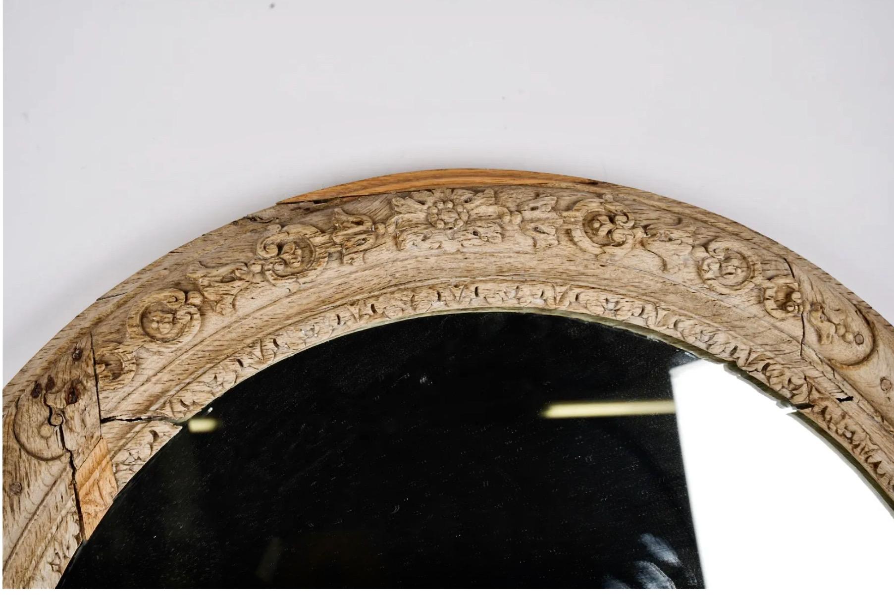 This is a wonderfully naturally patinated hand carved oval frame that most probably originally held a portrait. The frame was created in the late 17th or early 18th century and originally was gold leafed. Over its 300 years of life it has been