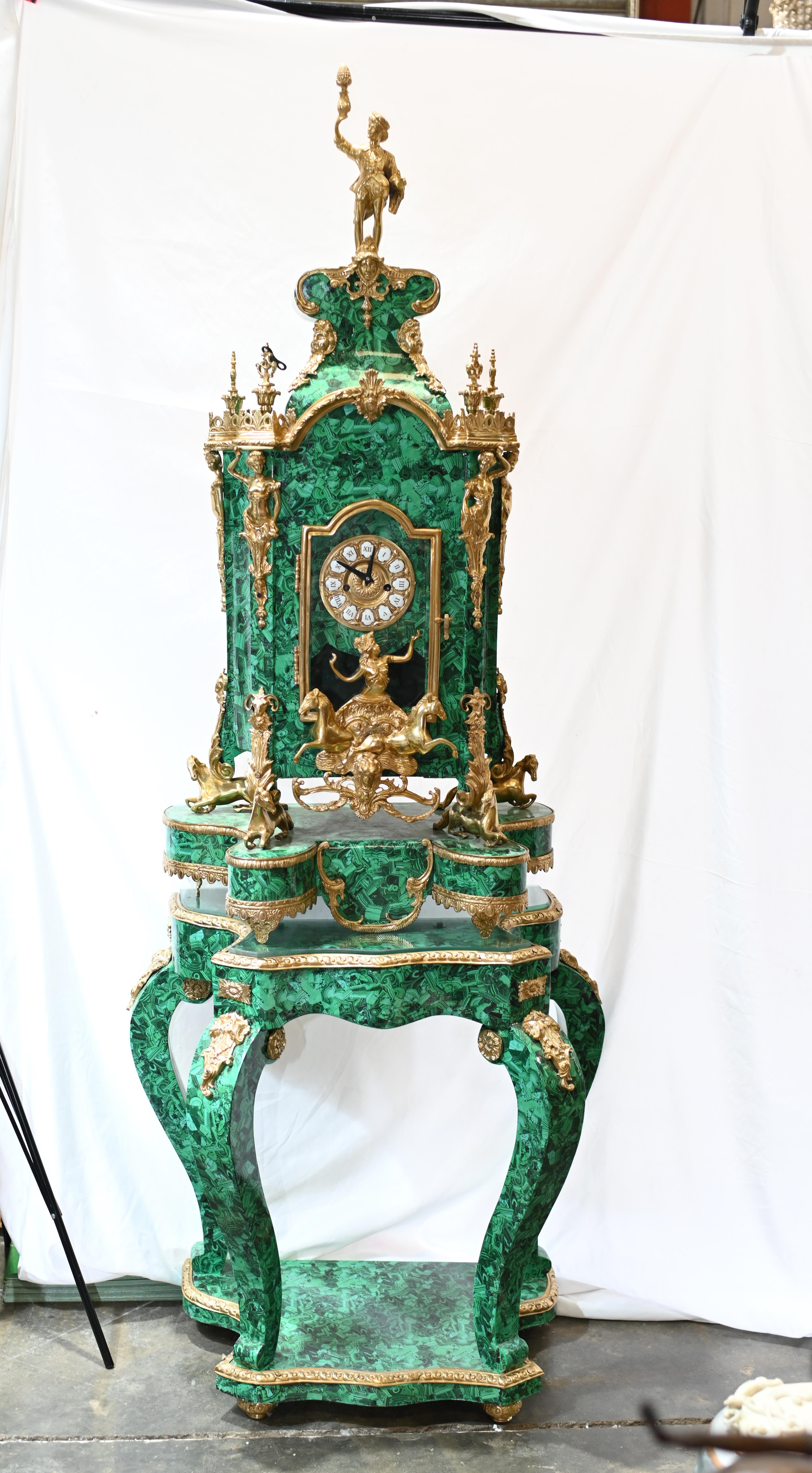 You are viewing an incredible malachite and ormolu clock
Large clock stands on the malachite stand with cabriole legs
Such a high end maximalist look
Ormolu fixtures are original and include the male figurine surmounting the top
Also feature maidens