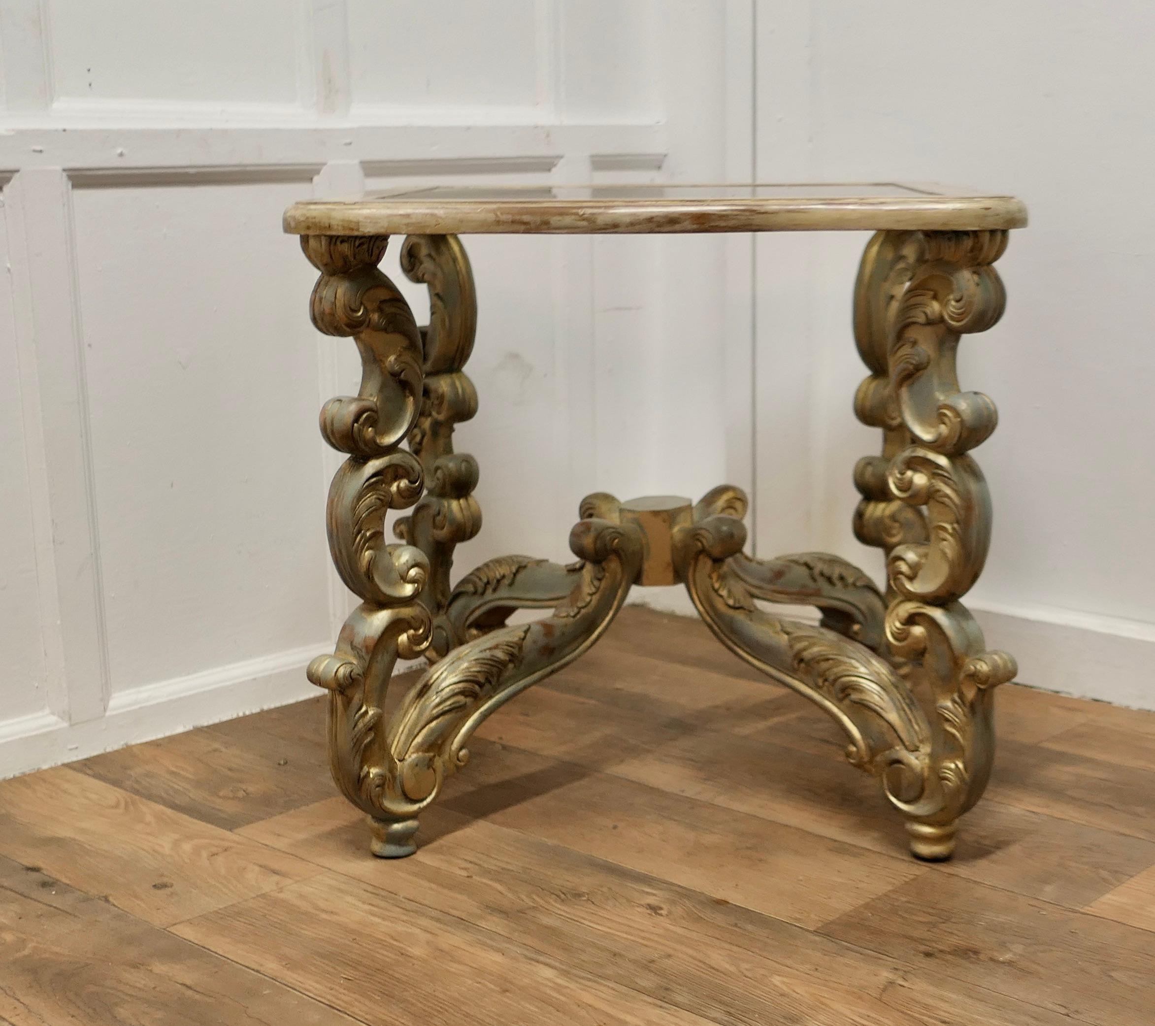  French Baroque Style Carved and Painted Occasional Table

This is a very unusual piece, the table is hand carved with bold scroll and acanthus decorative legs and elaborate crossing stretcher beneath
The table top is square with a waved edge and an