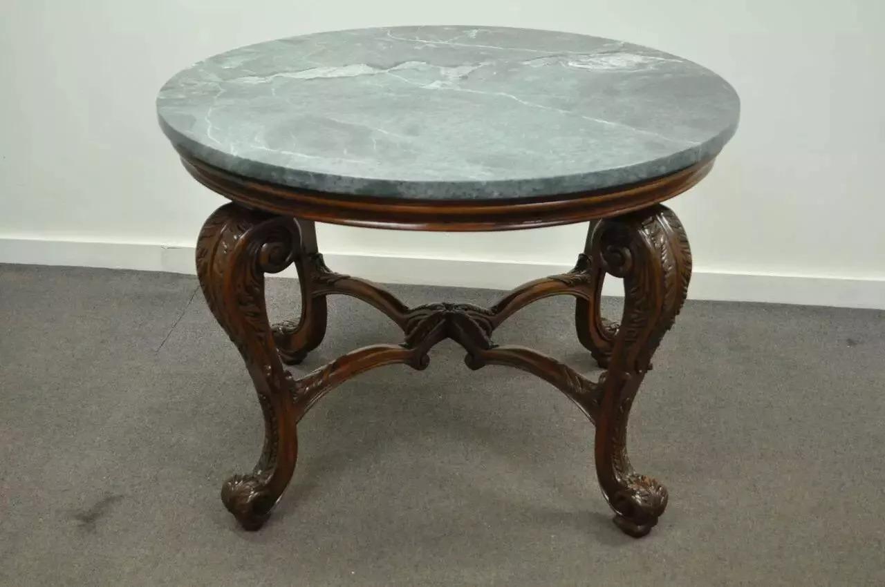 French Baroque Style Carved Mahogany and Green Marble Top Round Center Table. Item features shapely carved cabriole legs, wonderfully carved X-form center stretcher support, beautiful green marble top with fabulous veining, and a stately overall