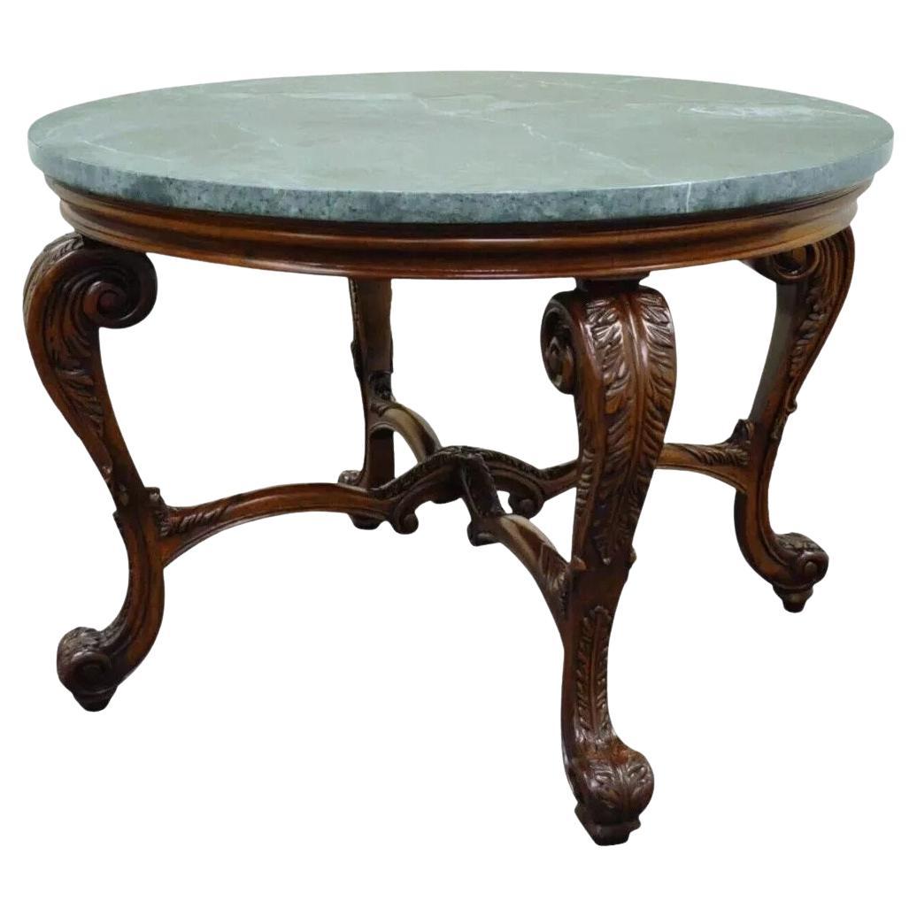 Mesa de centro redonda de estilo barroco francés tallada en caoba y tapa de mármol verde