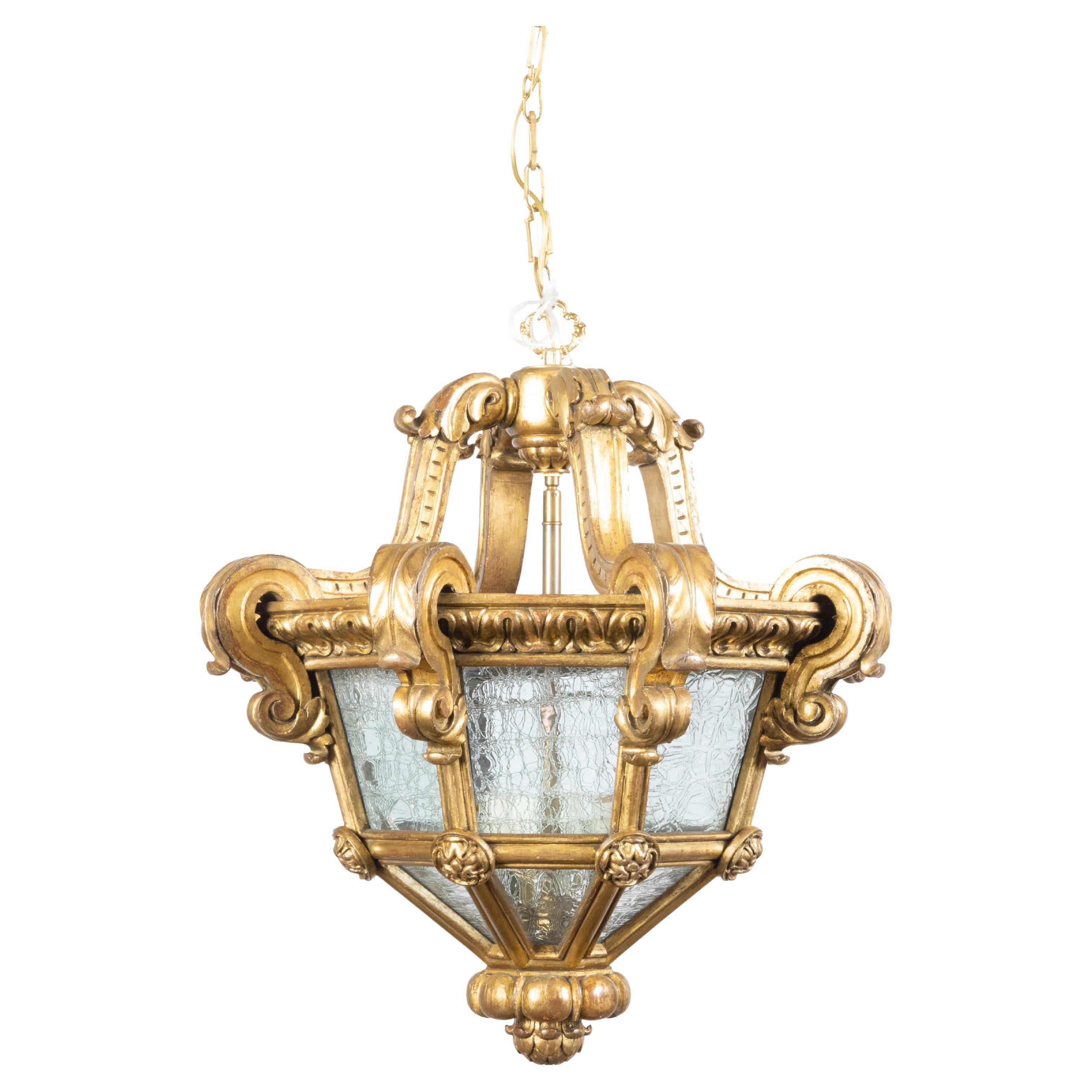 French Baroque Style Giltwood Lantern with Carved Volutes and Textured Glass For Sale