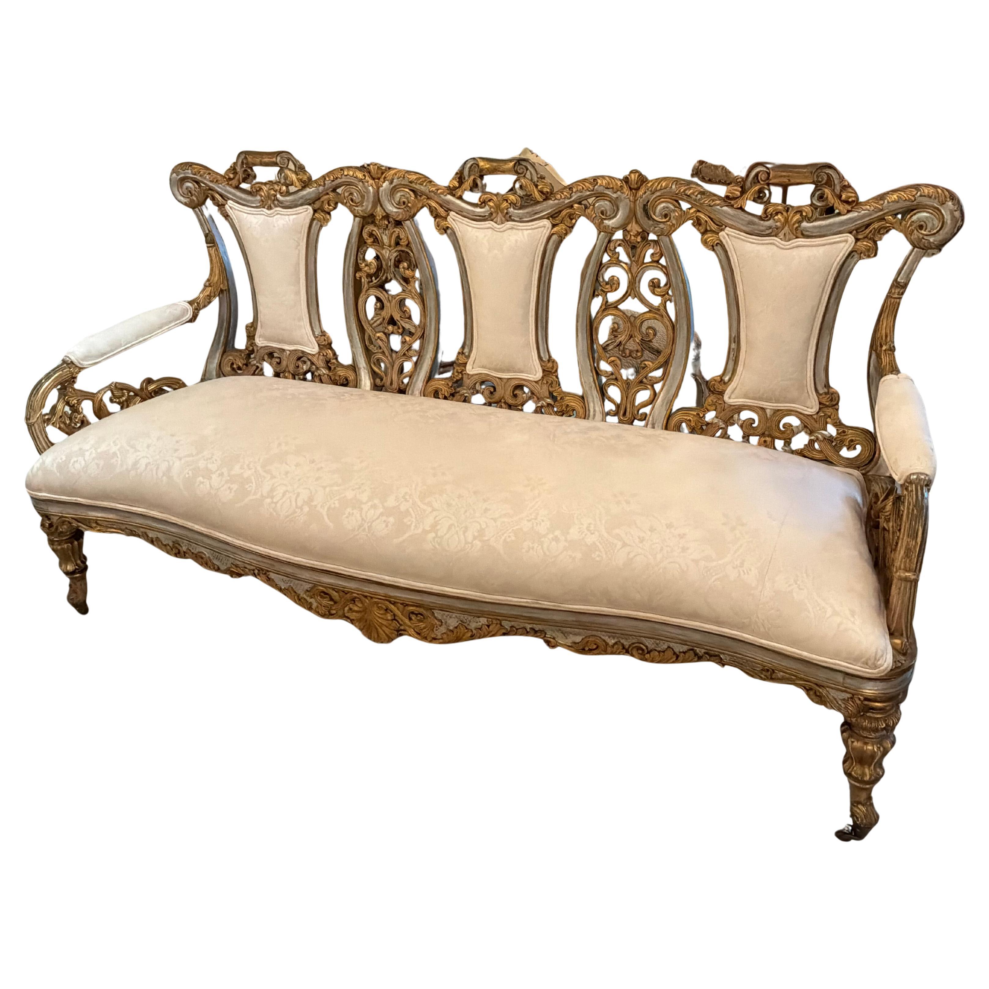 French BaroqueStyle settee in gilt gold and silver finish, hand carved