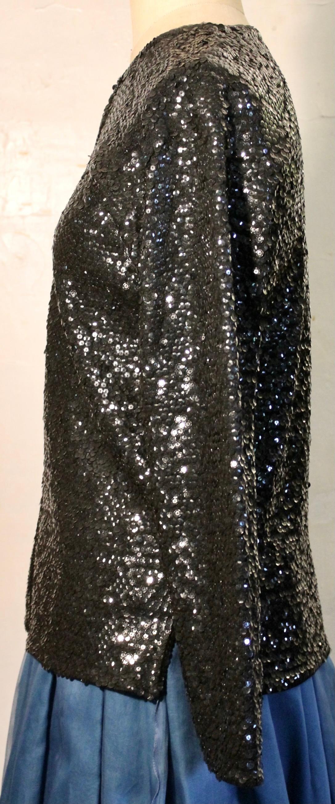 Constructed of shiny black round plastic beads.  Hand Sewn on crepe lining.