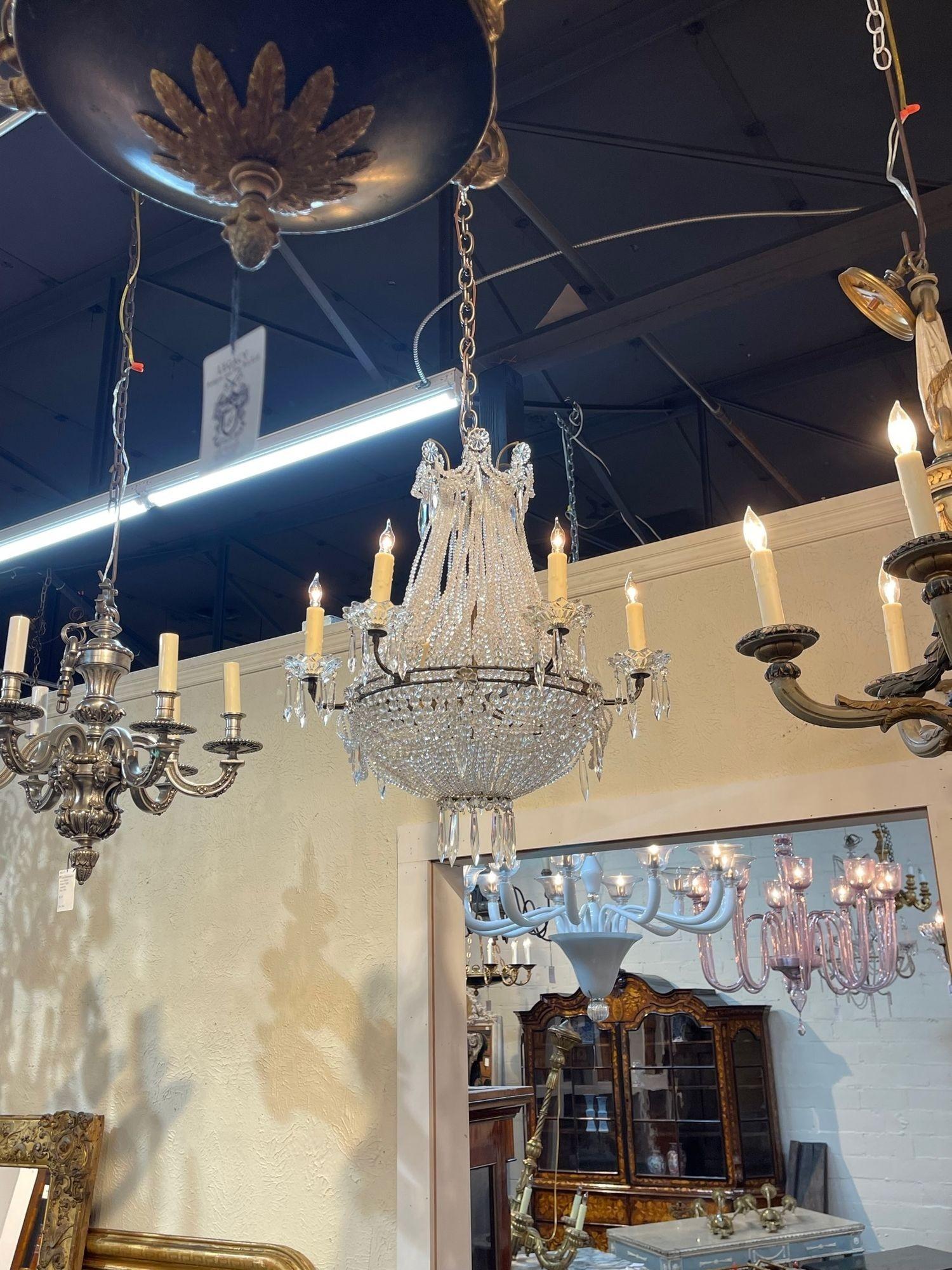 Vintage French beaded crystal 6-light basket form chandelier. Circa 1940. The chandelier has been professionally re-wired, cleaned and is ready to hang. Includes matching chain and canopy.