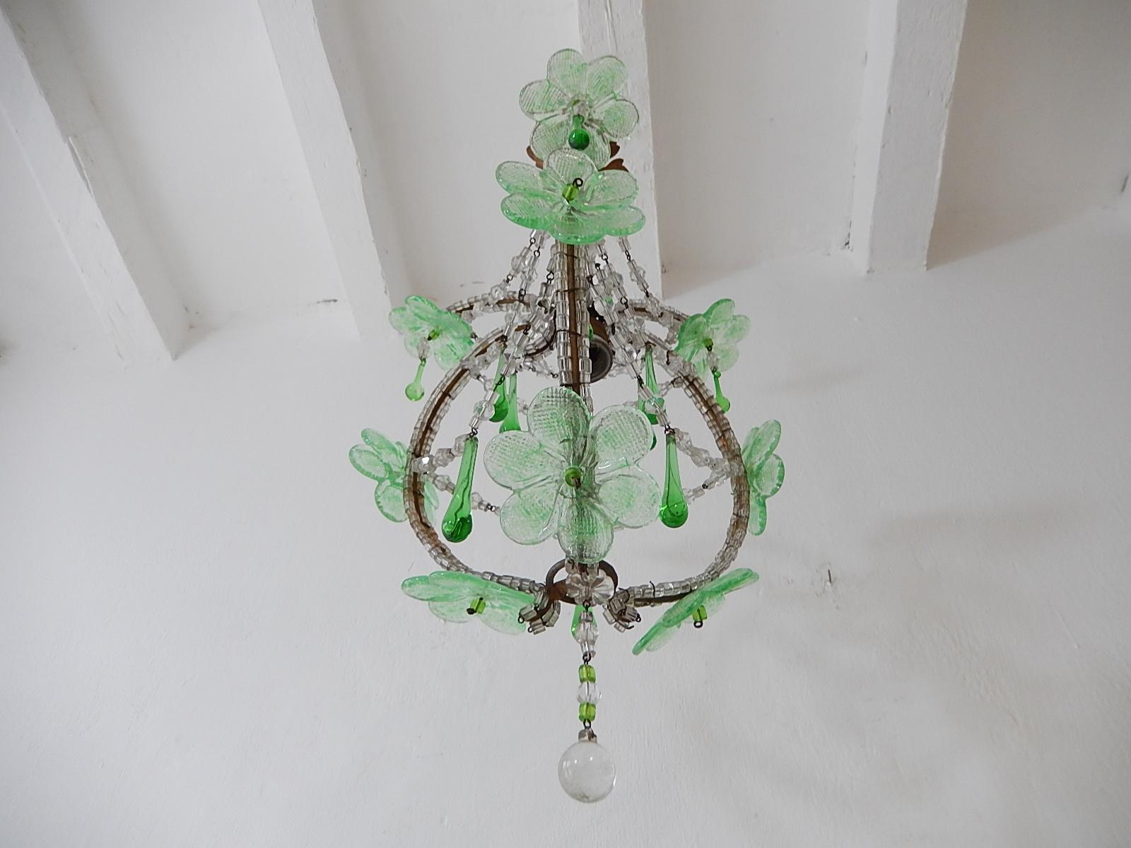 Housing one light in center. Body completely macaroni beaded with swags of crystals. Adorning 9 big Murano glass green flowers with green beads. Also, green Murano drops. Adding another 7