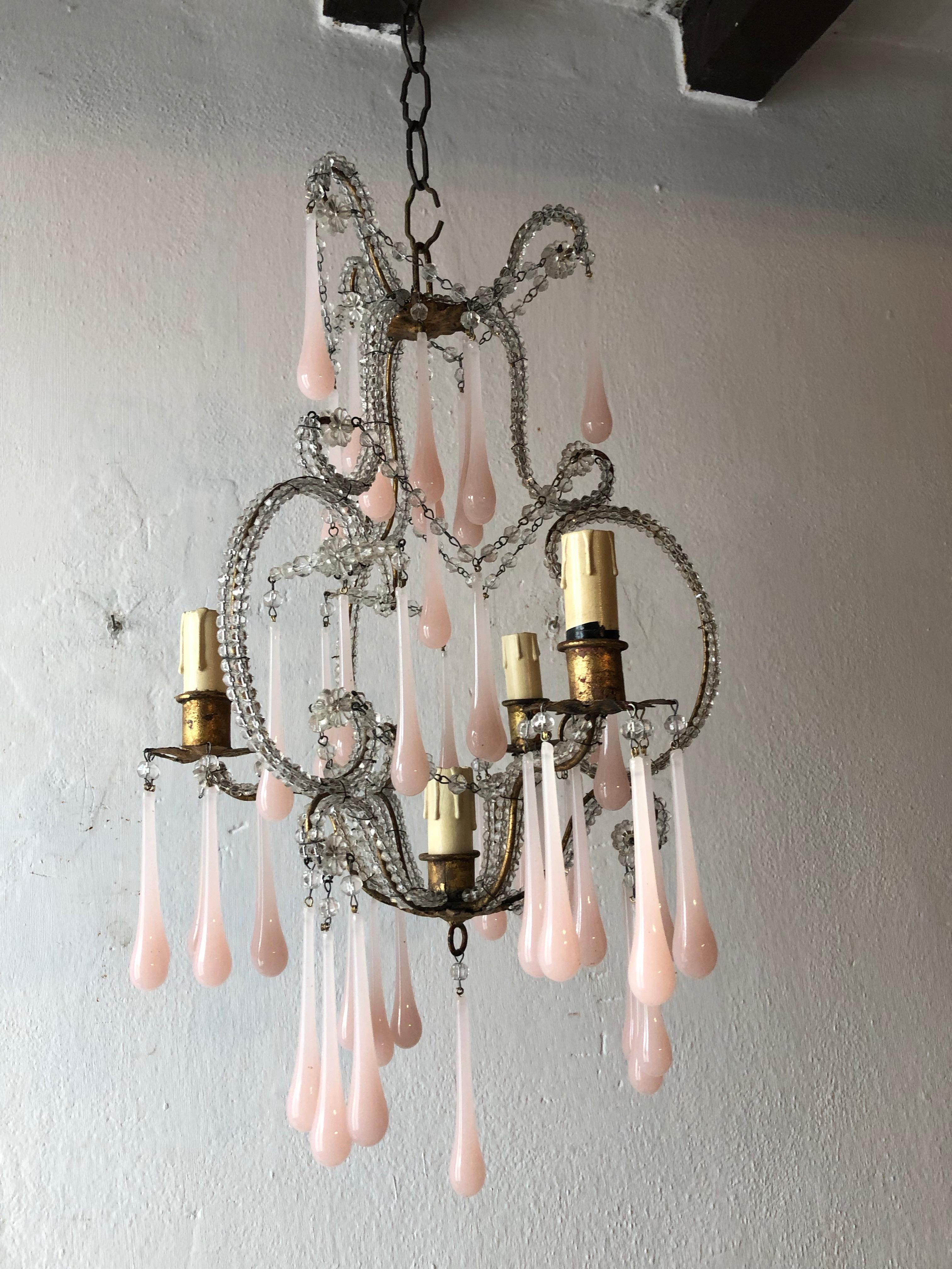 Rewired and ready to hang. Housing 4-lights. Swags of macaroni beads and florets throughout. Double beaded body with nearly 50 pink opaline Murano drops. Free priority shipping from Italy.