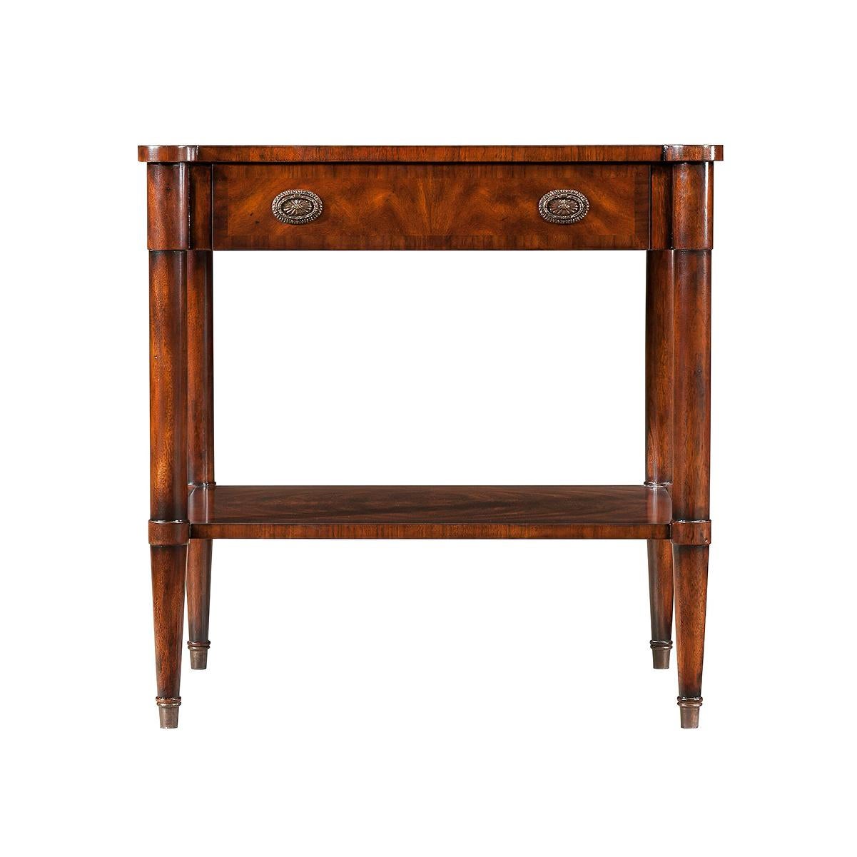 A neoclassic style French bedside table, the rectangular top with rounded protruding corners and one frieze drawer, on turned legs joined by an under tier.

Dimensions: 28