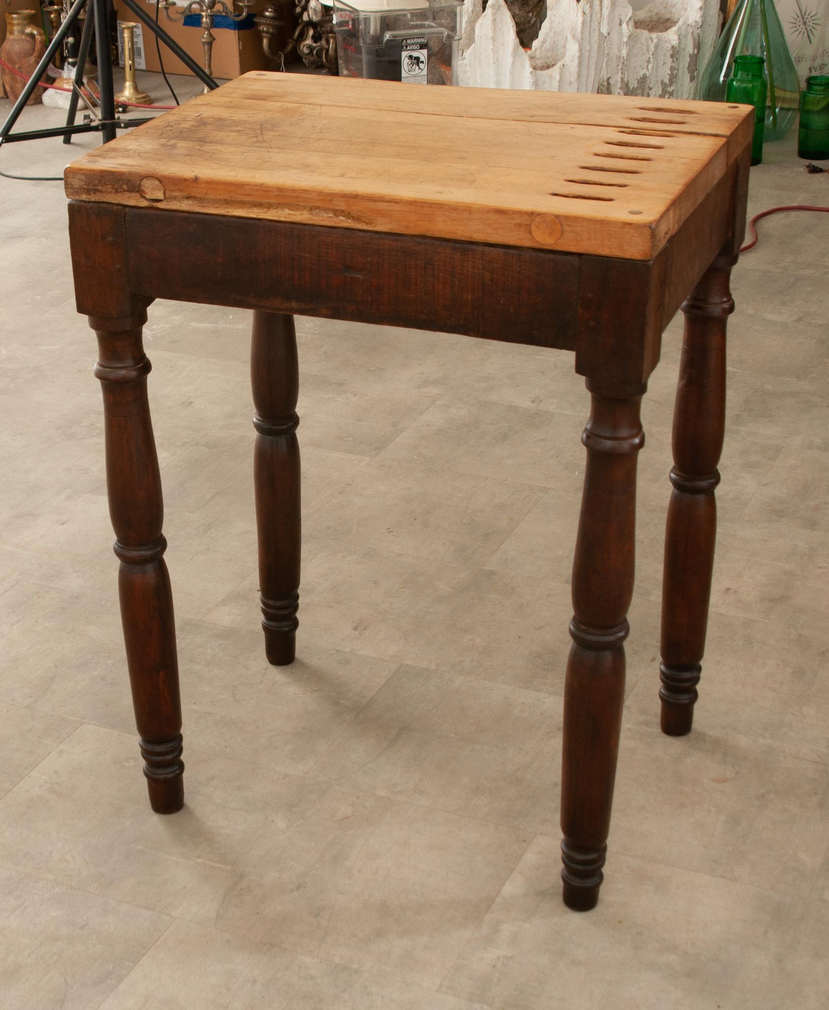A fantastic little chef’s table, this French 19th century charcuterie table teems with character and functionality. The table features a chopping board top with slots to hold up to eight knives. The 1-½” thick top is an ideal surface for cutting,