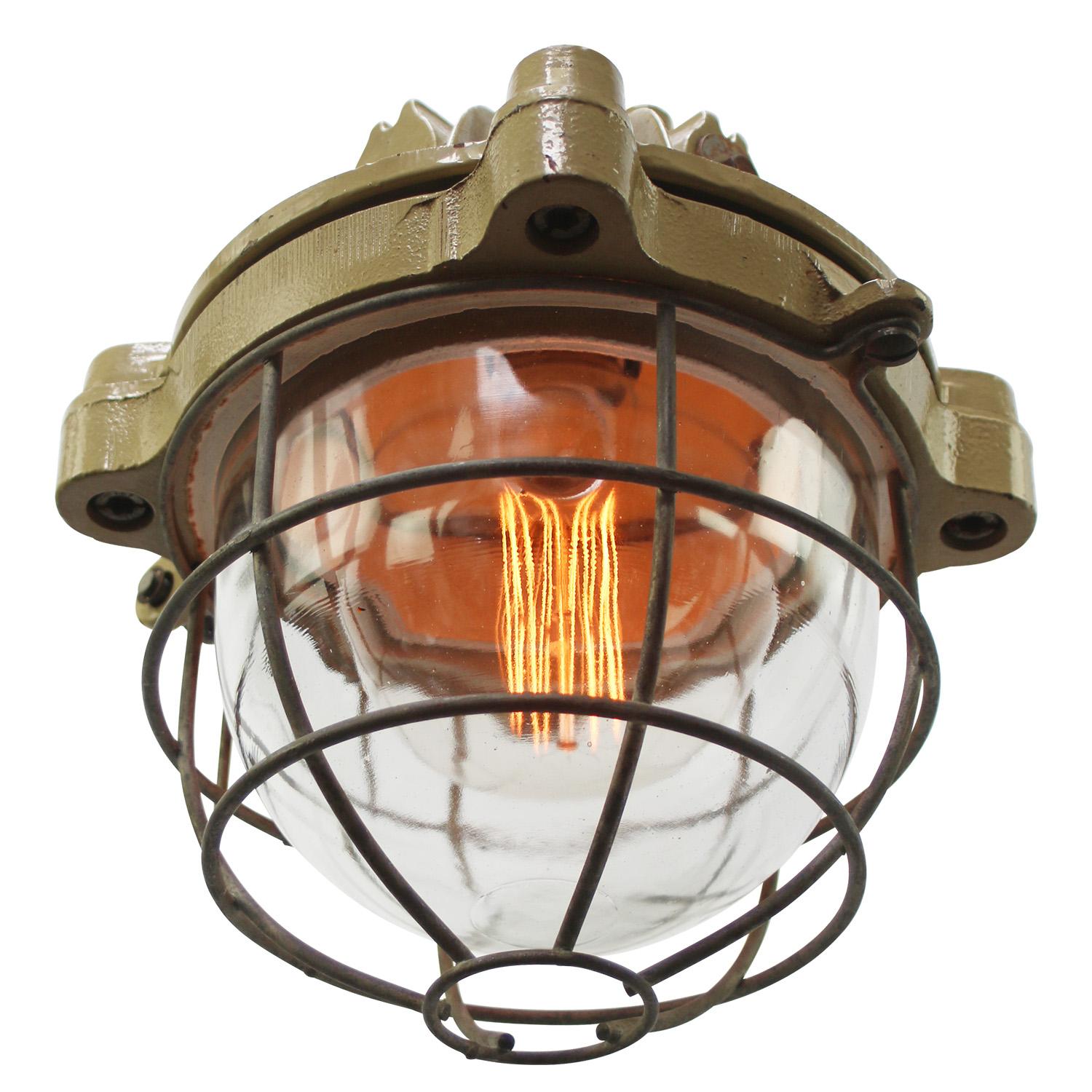 French industrial hanging lamp by Mapelec Amiens. 1966
Brown / Beige cast iron with cage
clear glass

Heavy!

Weight: 13.80 kg / 30.4 lb

Priced per individual item. All lamps have been made suitable by international standards for incandescent light