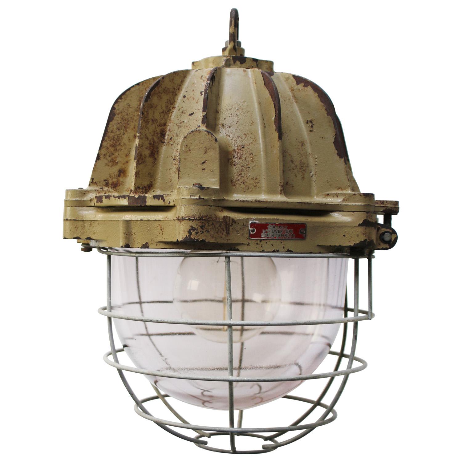 French industrial hanging lamp by Mapelec Amiens. 1977
Brown / Beige cast iron with cage
clear glass

Heavy!

Weight: 28.00 kg / 61.7 lb

Priced per individual item. All lamps have been made suitable by international standards for incandescent light
