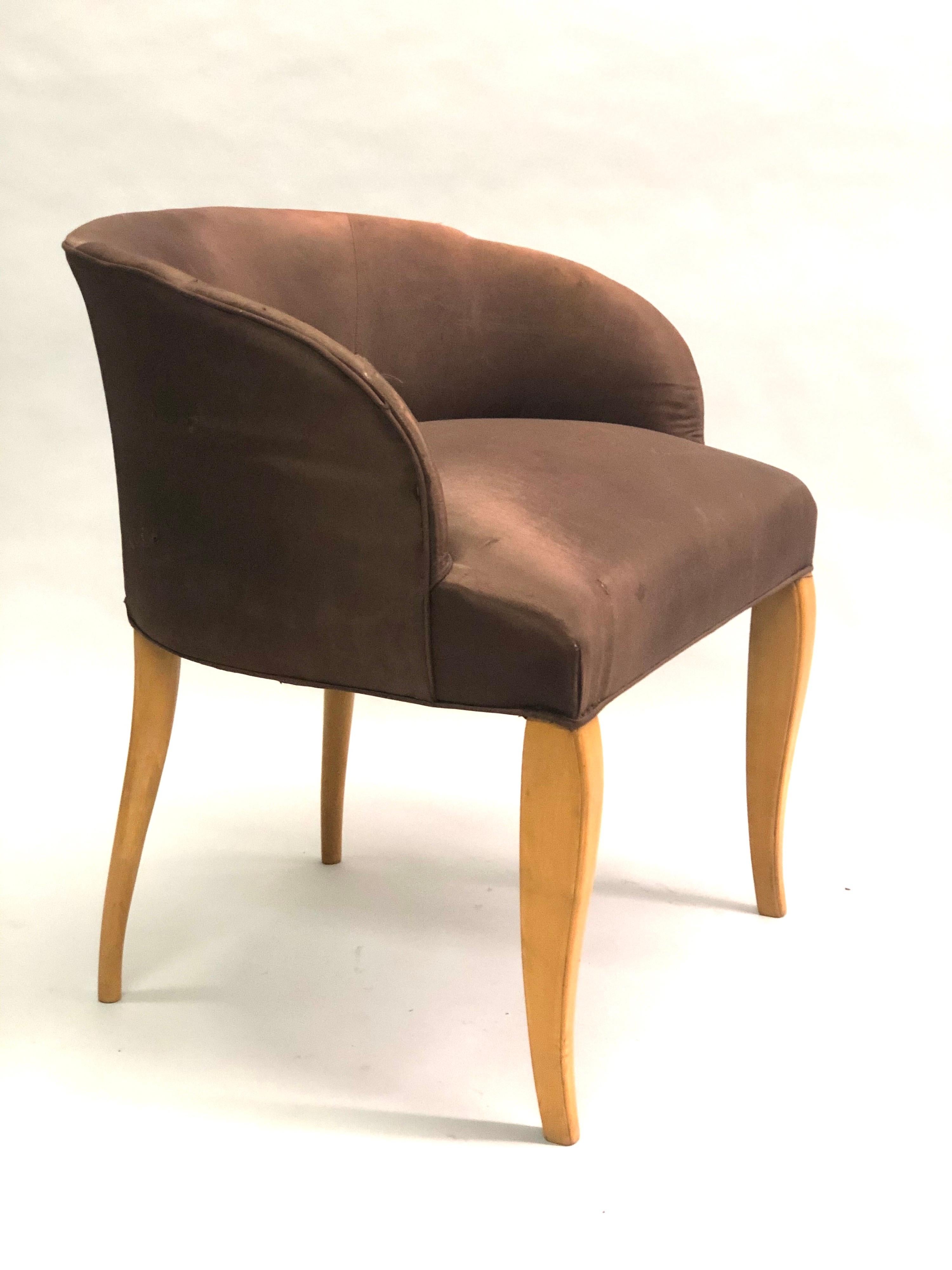 Elegant, stylish French / Belgian Art Deco vanity chair in Sycamore wood by Van der Borcht Freres, circa 1925-1930. The piece has an exquisite form highlighted by the sloped, oval, barrel back which is supported by contrasting front and rear saber