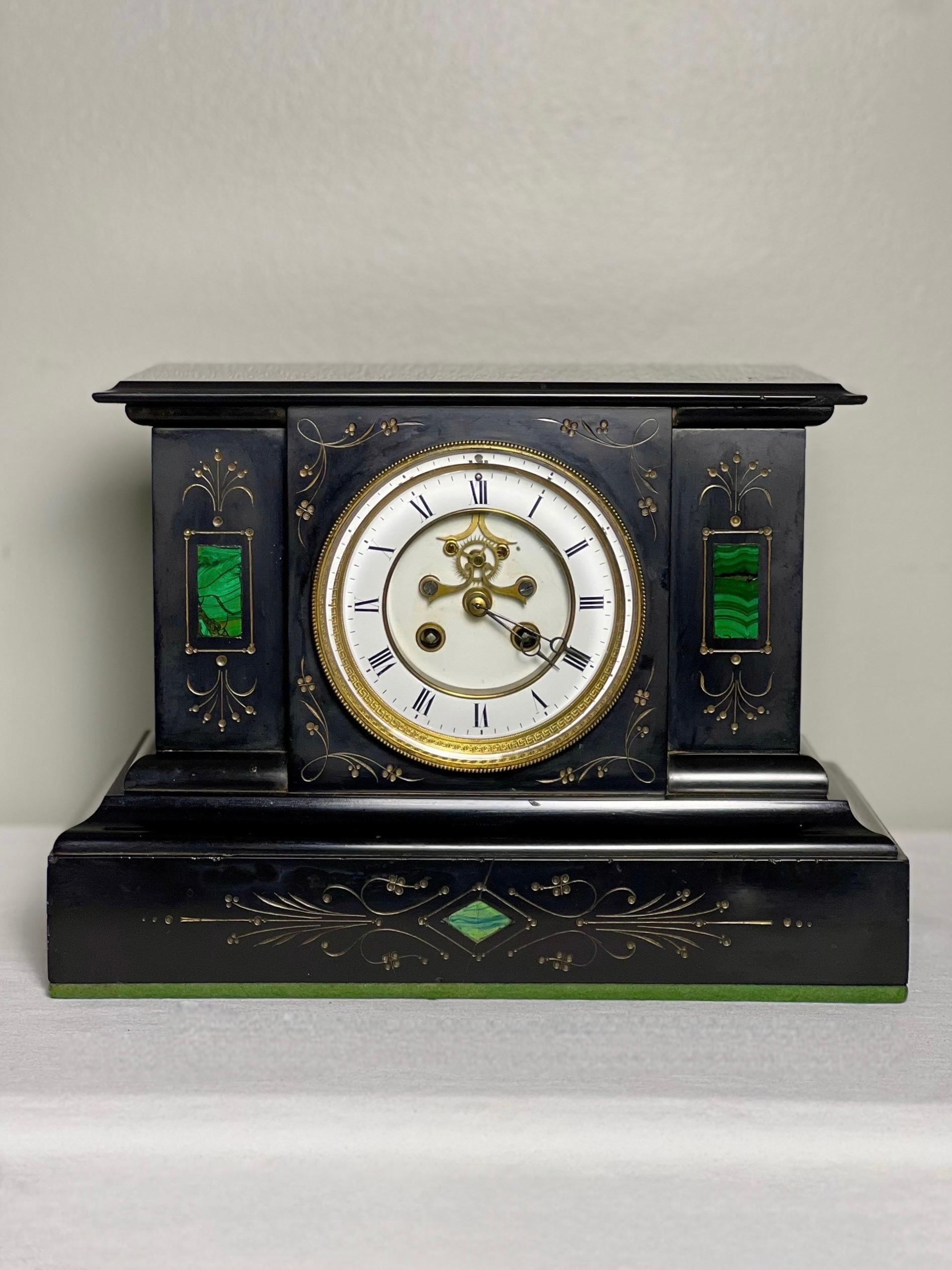 Horlogerie Paris French Belgian black slate visible escapement mantle clock with malachite inlay, circa 1880.  An exquisite showpiece with French eight-day movement reflecting the high standards of quality associated with Parisian clock making.  It