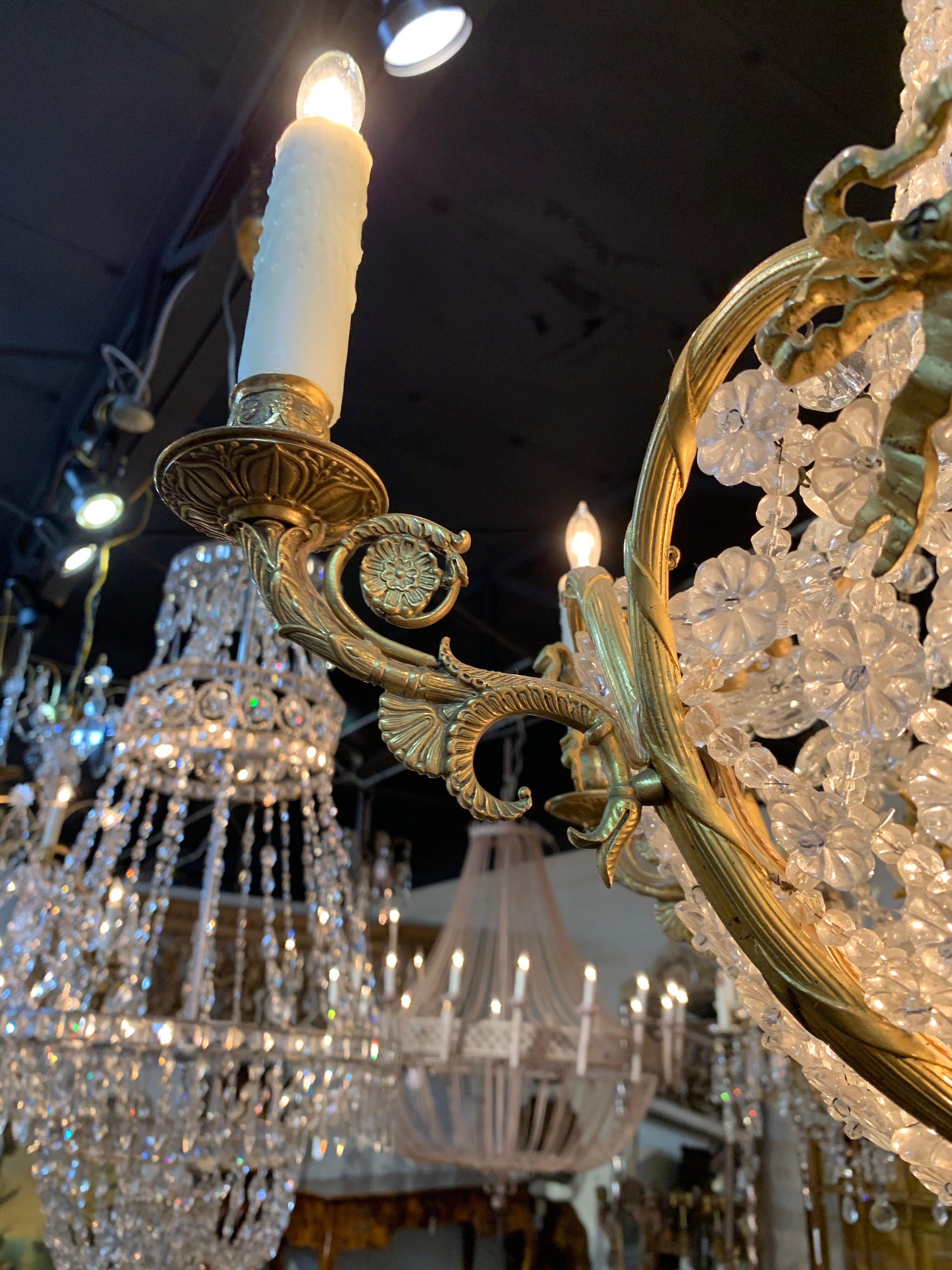 Stunning French Belle Epogue gilt bronze beaded crystal chandelier with 6 lights. The bottom section has beads in the shape of flowers. And the top section has strands of very fine quality beautiful crystals. Creates a very elegant look!