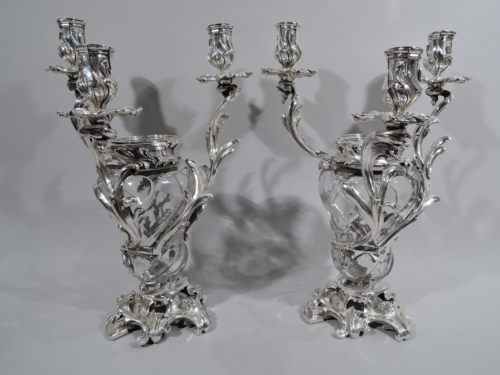 Set of 4 French Belle Époque crystal and silver vase candelabra, circa 1890. Each: Lobed baluster crystal vase with wraparound silver leafing, each terminating in single leaf-wrapped socket with petal wax pan. More leafing applied to rim. Open