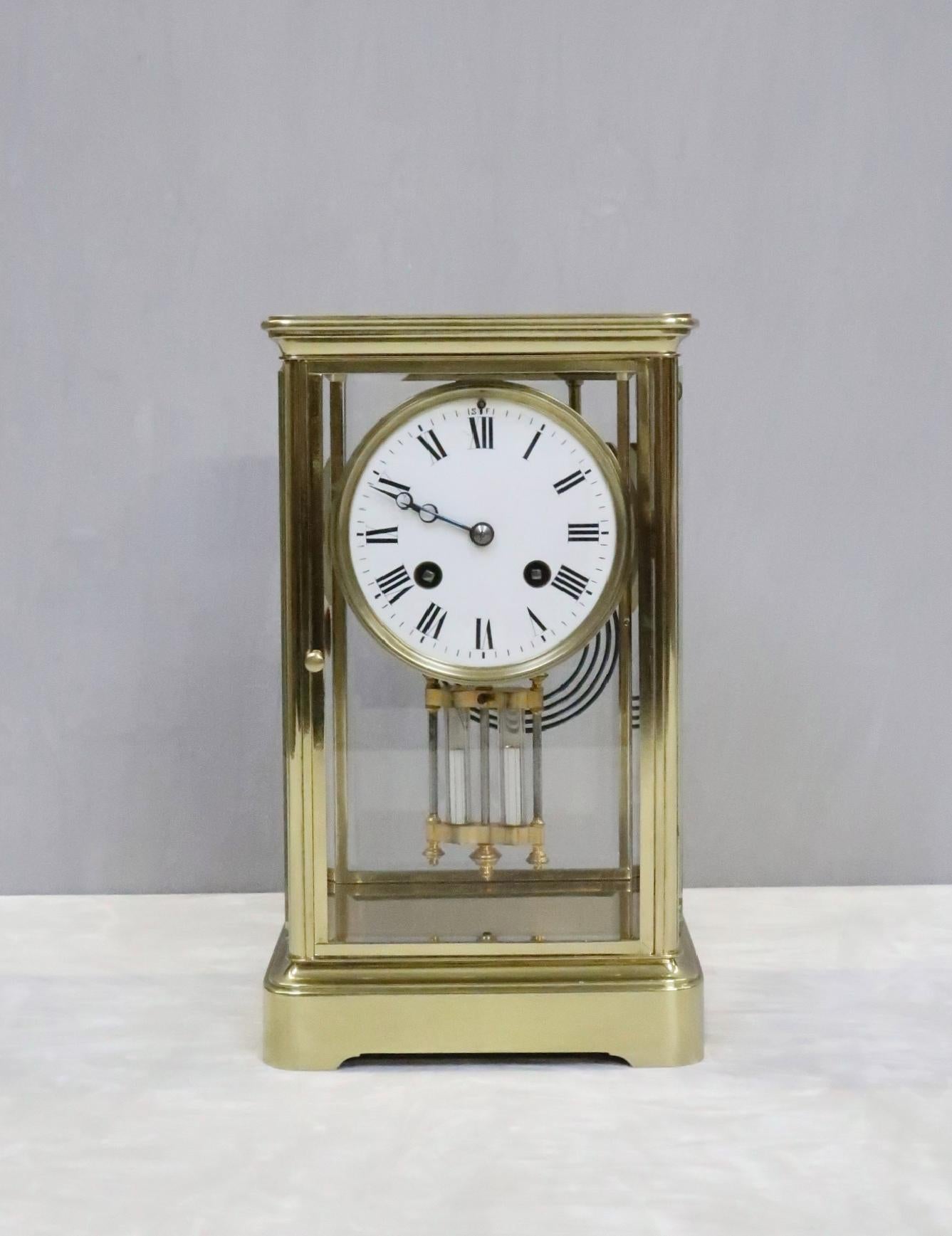 A good quality French Belle Époque brass mantel clock with four bevelled glass panels. The clock has a white enamel dial with a French eight day movement which strikes the hours and half hours on a gong.

The movement back plate is stamped with