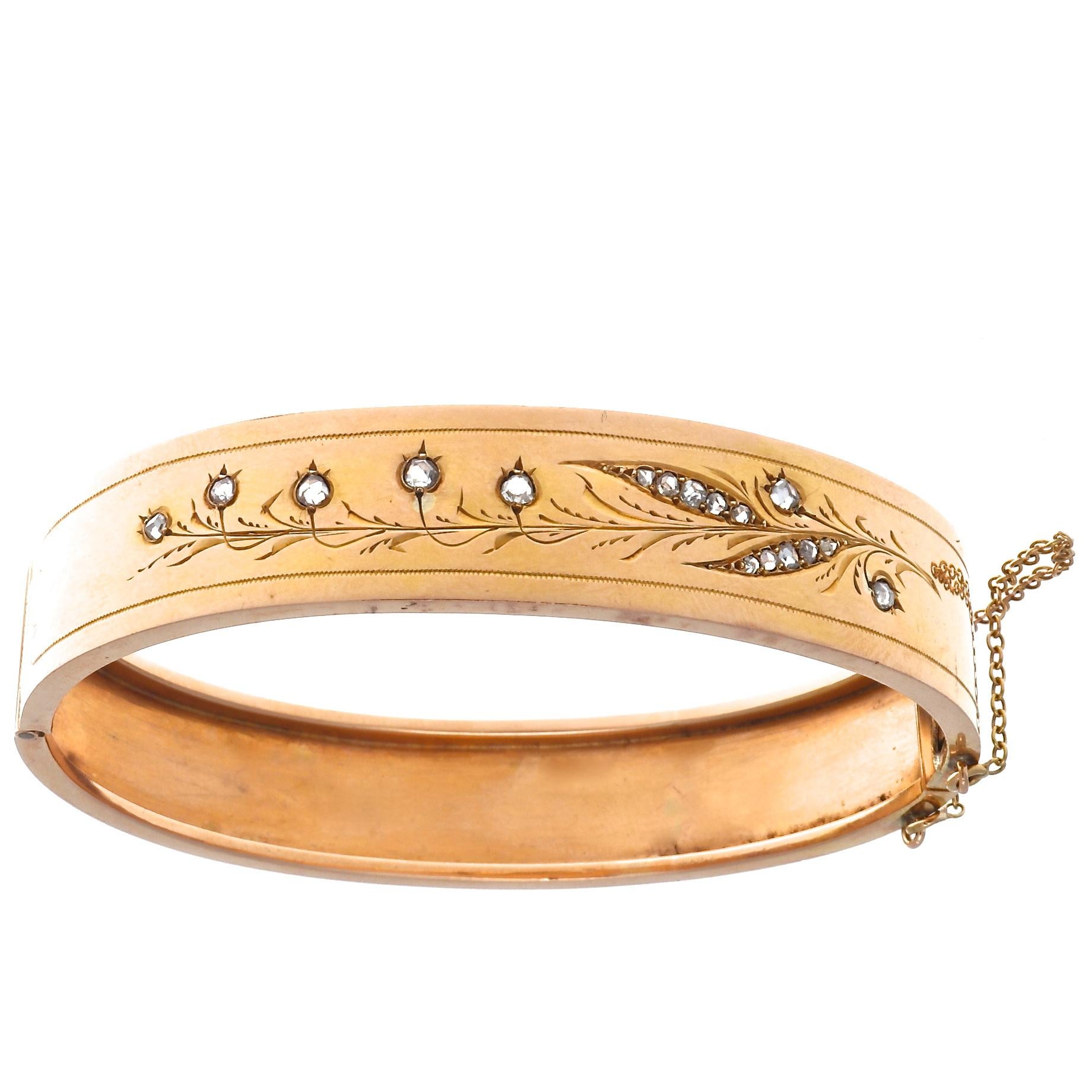 Lovely French Belle Époque diamond 18k rose gold bangle bracelet with safety clasp chain. Accented by 17 rose cut diamonds that weigh approximately 0.50 carats, graded G,H color, VS,SI clarity. Circa 1800s. 
7 day return policy for full cash