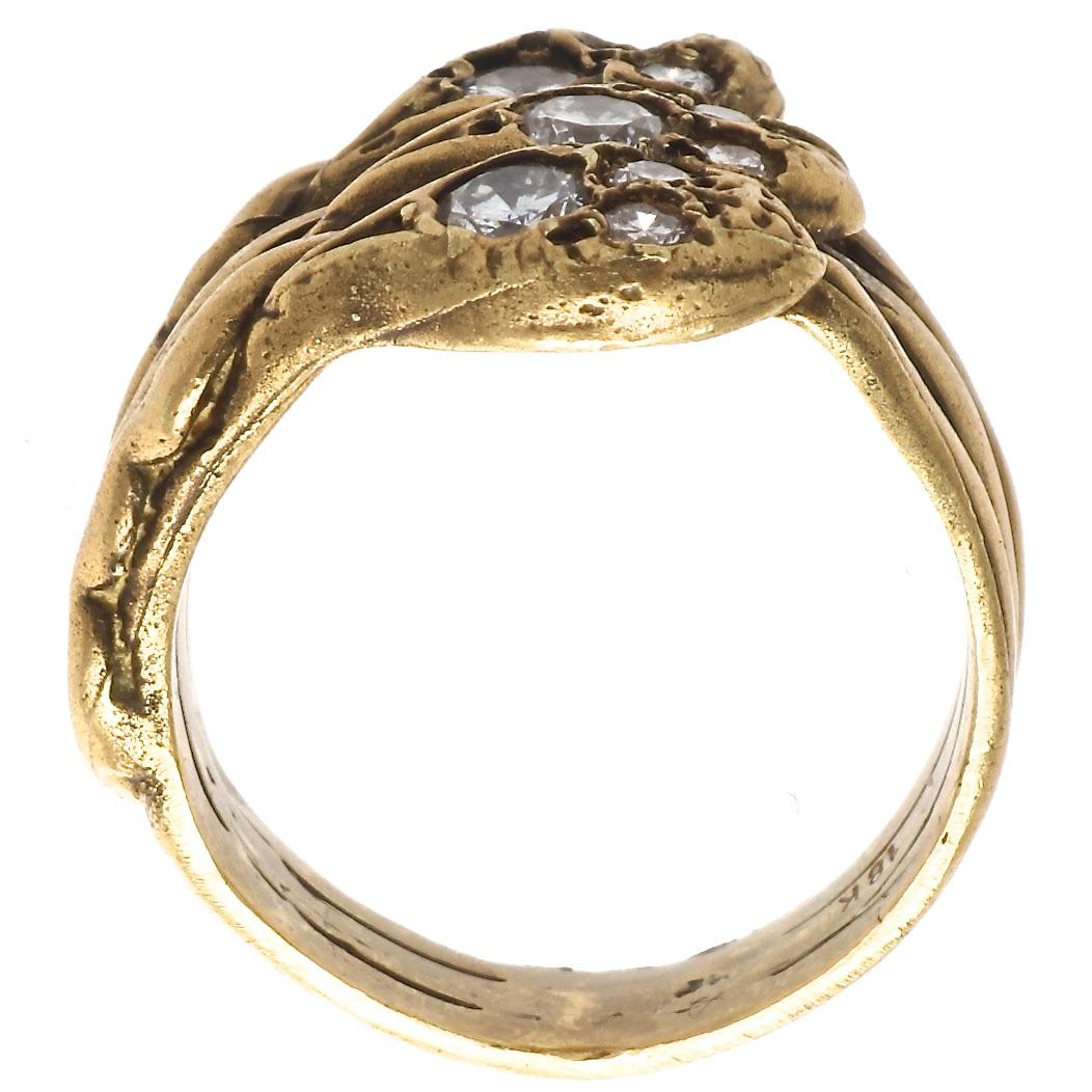 French import Belle Epoqué diamond 18k snake ring. Featuring 9 round brilliant cut diamonds weighing approximately 0.50 carats graded as G-H color, VS clarity. Ring circa 1800's, with modern diamonds. Ring size 5 and comes with complimentary sizing