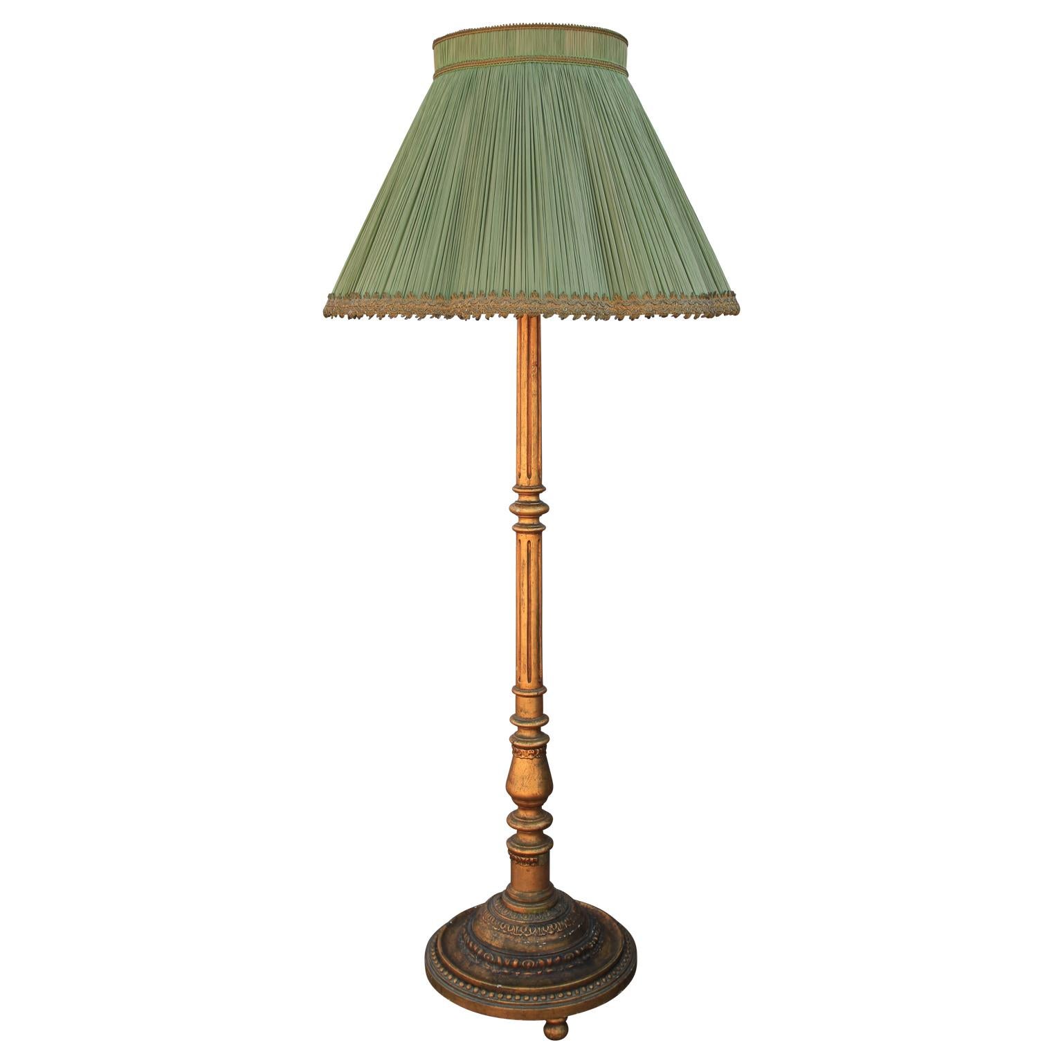 Fantastic French giltwood floor lamp with a wonderful green shade, circa early 20th century. Can be rewired if requested.

 Dimensions of shade: H 18 in. x W 29 in. x D 29 in.
