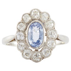 Anello a grappolo in platino con zaffiro azzurro e diamante Belle Époque francese
