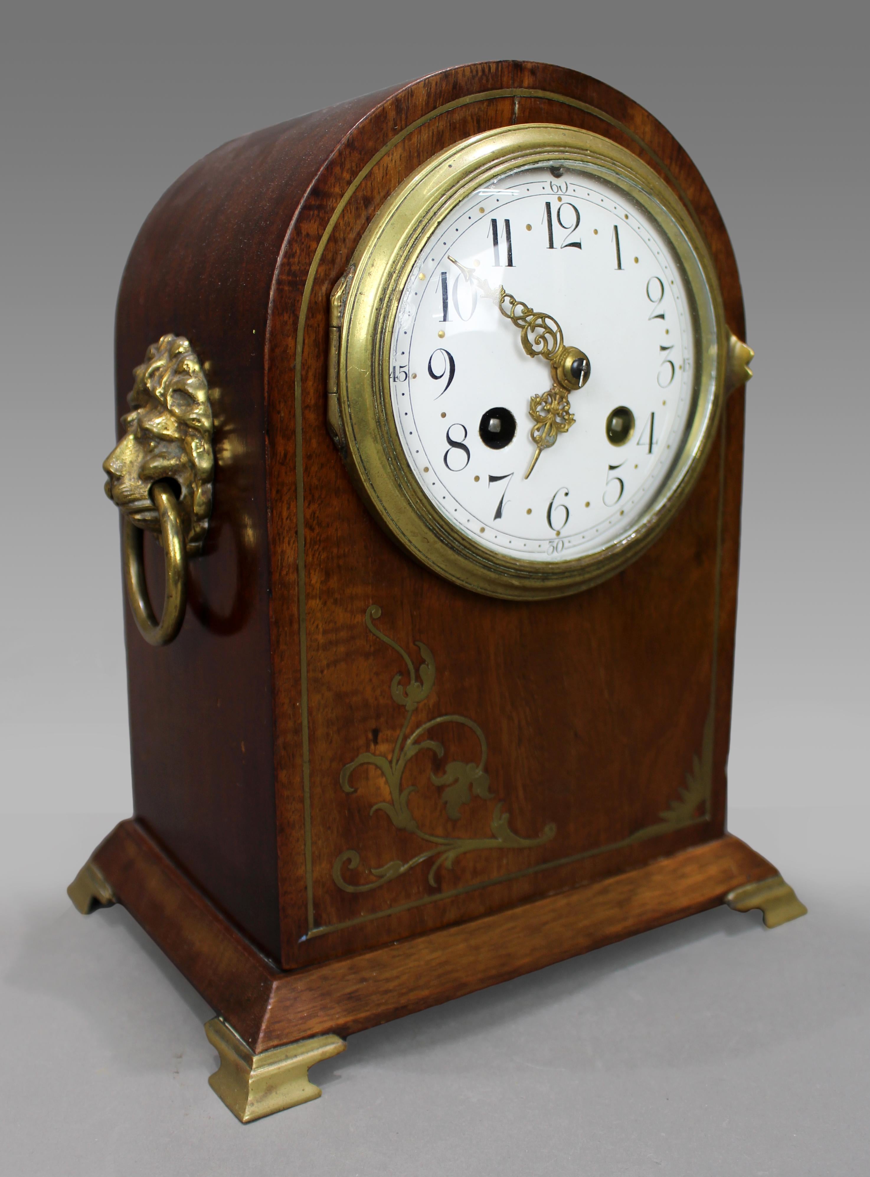 
French Belle Époque Mahogany and Brass Inlaid Mantel Clock by Samuel Marti, circa 1900
A finely crafted French mantel clock from the Belle Époque period, attributed to the esteemed maker Samuel Marti, Paris, circa 1900.

The arched case is executed