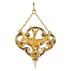 French Belle Époque Natural Pearl Garnet 18 Karat Yellow Gold Swallow Pendant