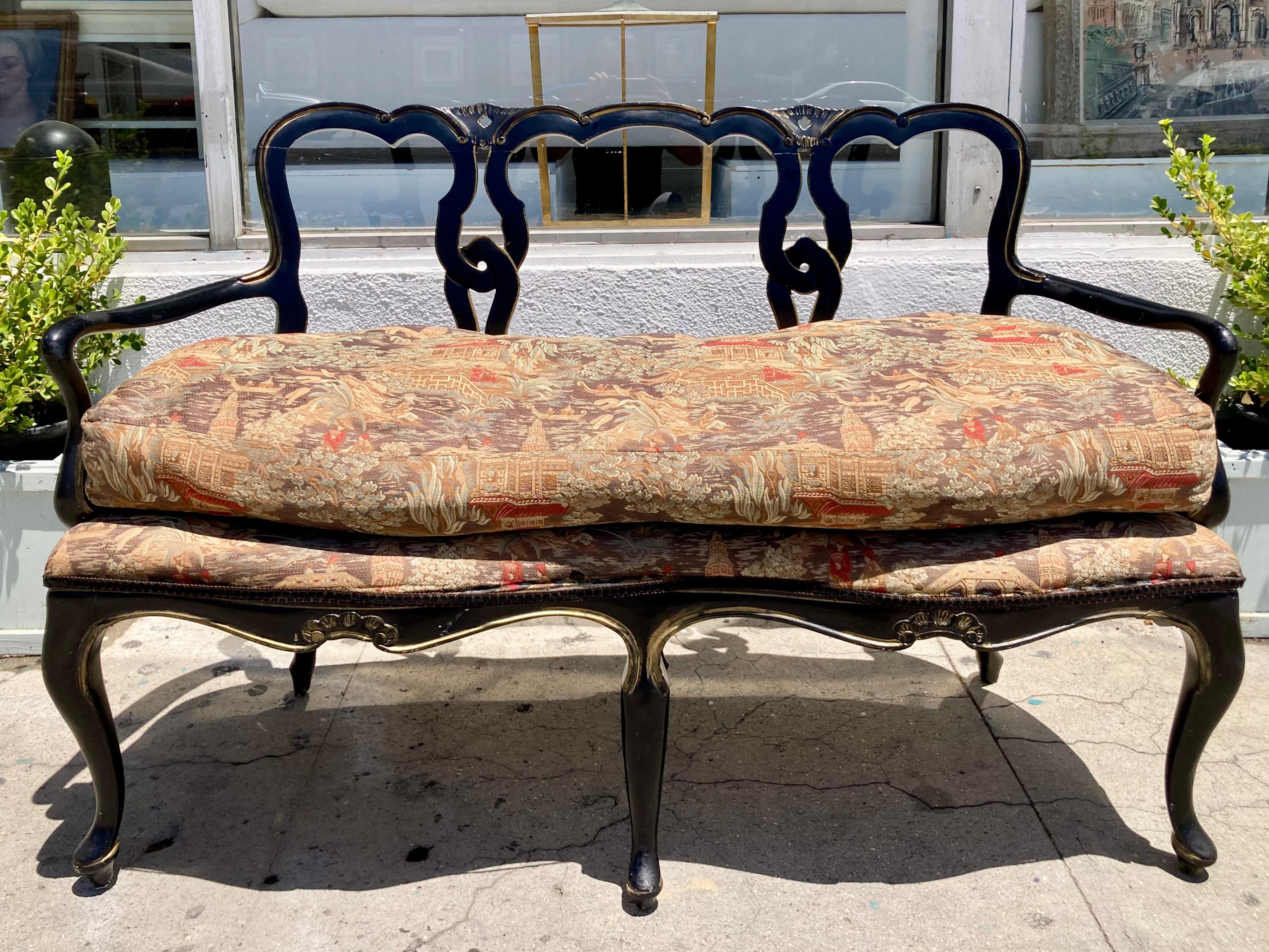 French ebonized lacquered bench with gilt details and Chinoiserie upholstery. Beautiful simple carving details pagoda textile upholstery. Use this bench in foyer or end of bed. Add some classic French style to your design project.