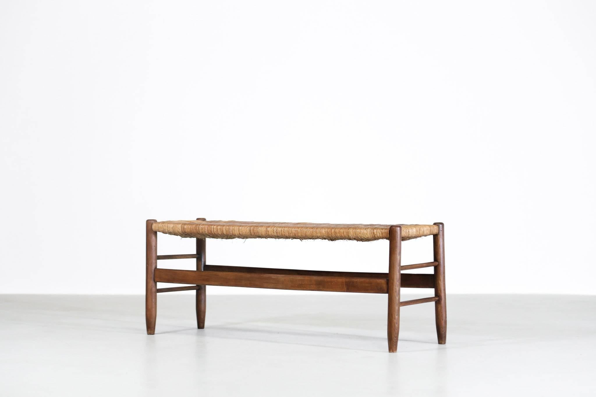 Nice French bench made in walnut and woven rush.