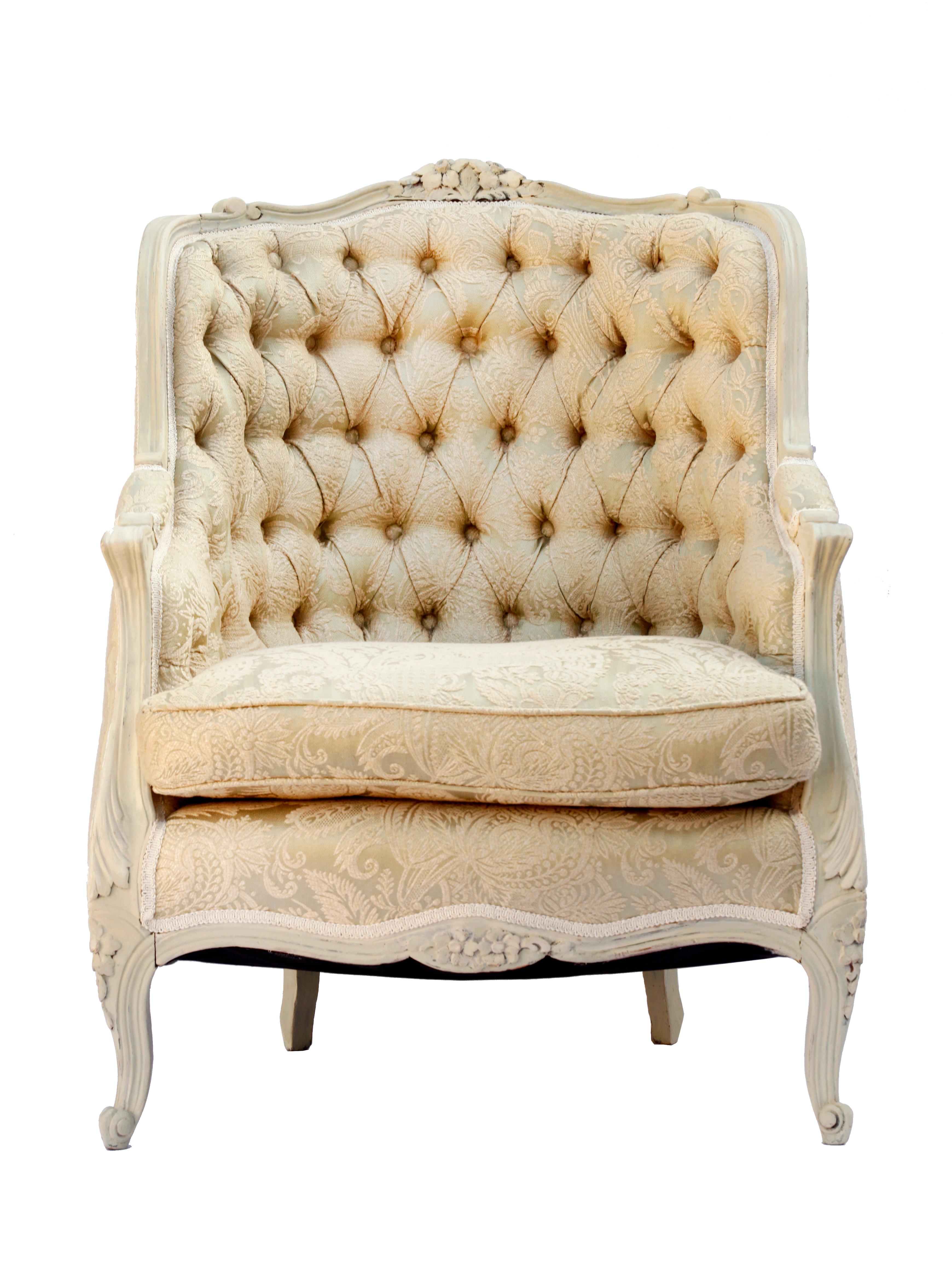 Early-20th Century/late 19th Century Italian bergère armchair in finely carved solid wood frame with hand carved floral accents, cabriole legs, comfortable tufted barrel back, upholstered in Clarence House silk.