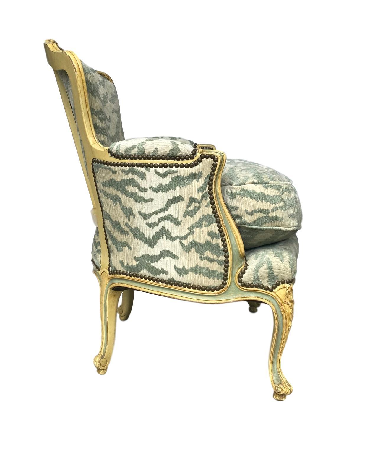 French Bergère Chair, Carved and Painted in Ivory and Celadon Newly Upholstered In Good Condition In Banner Elk, NC