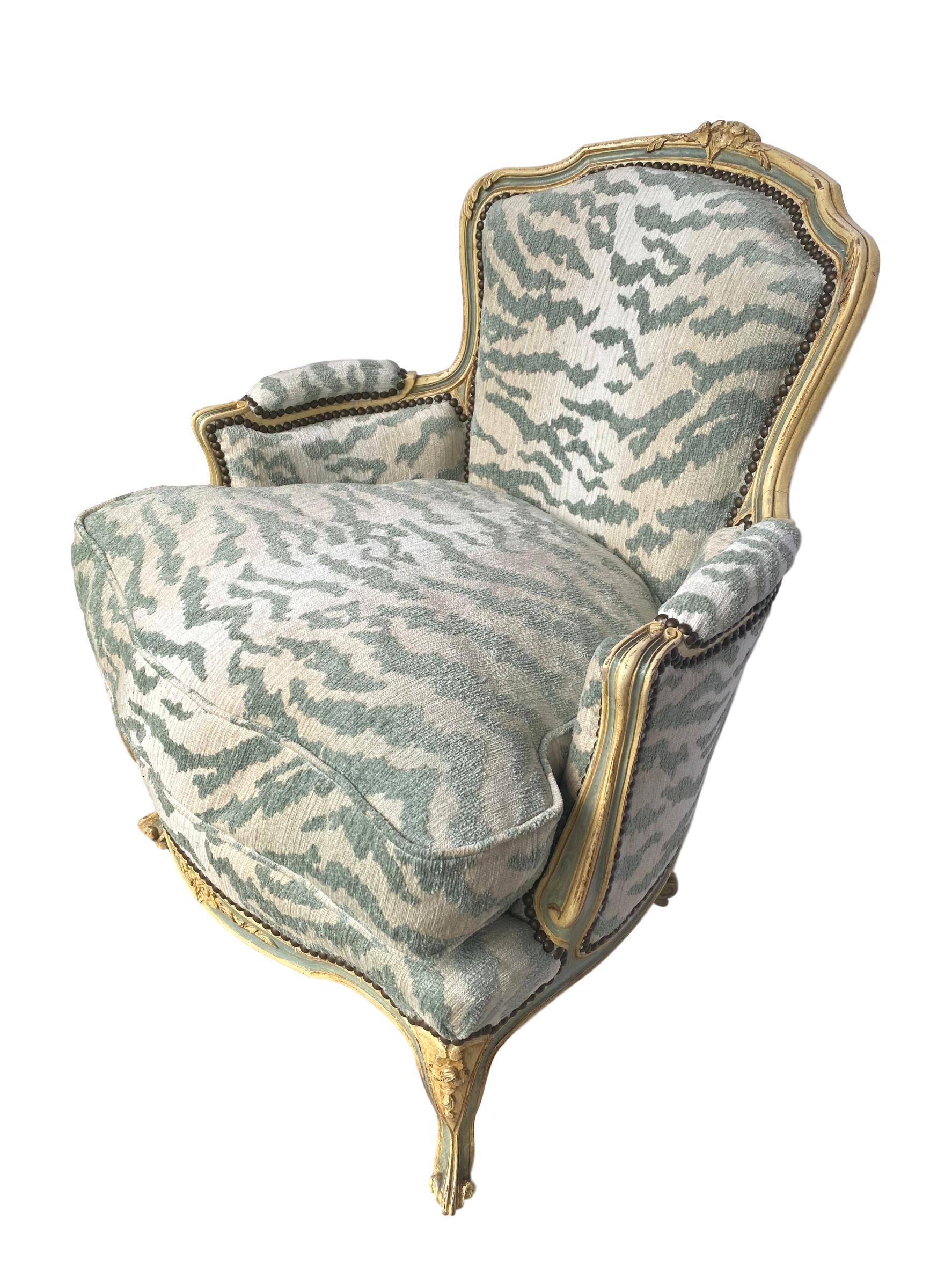 French Bergère Chair, Carved and Painted in Ivory and Celadon Newly Upholstered 1