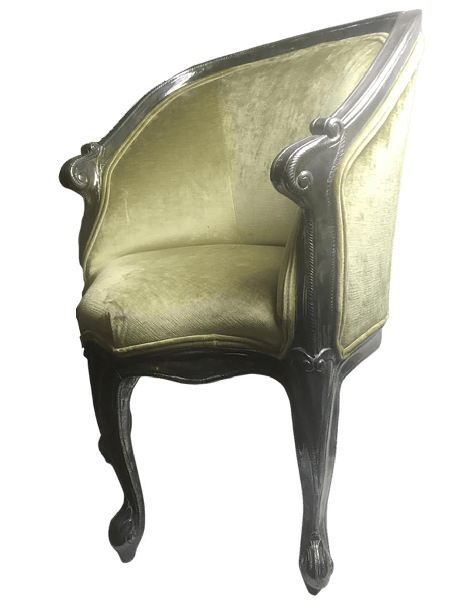 An exquisite French bergere chair in the style of Louis XV. Spring green velvet upholstery with a metallic silver clad trim and legs. There are two cabriole legs on the sides and one on the front and back of the front of the chair. This is a