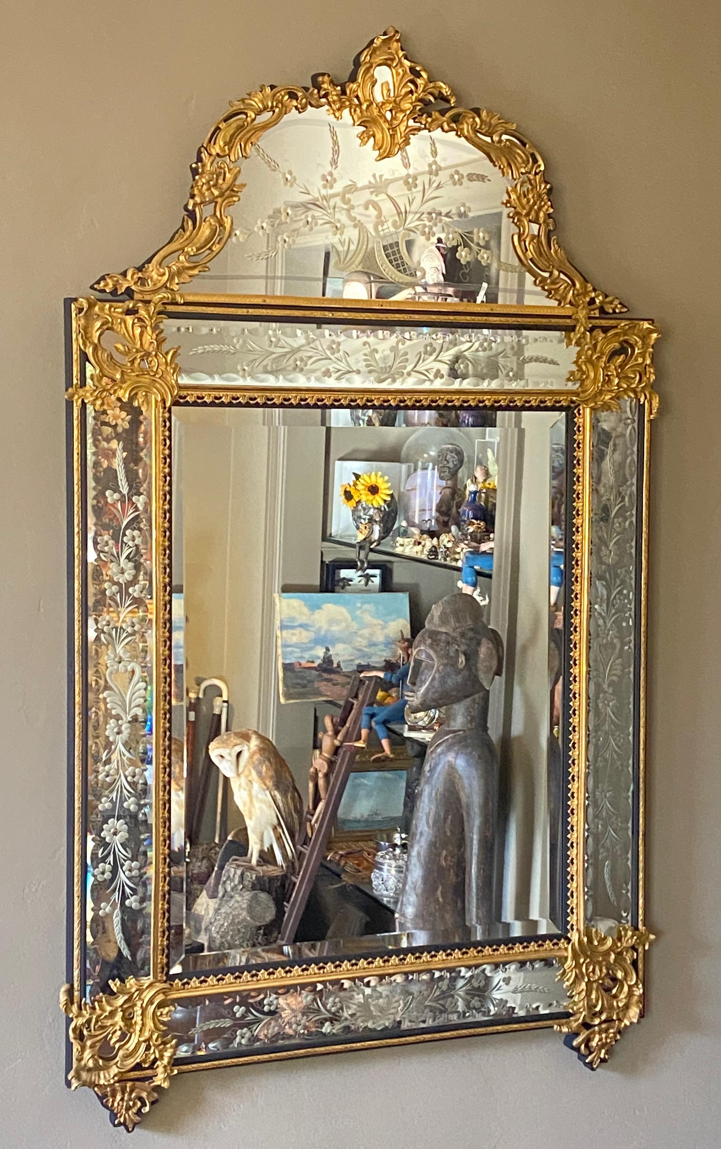 An ornate and beautiful quality beveled and etched glass mirror with cast brass overlay decoration.
In excellent original condition.
Mirror shows some light minor clouding in areas around the top pediment section.
France, early to mid-20th