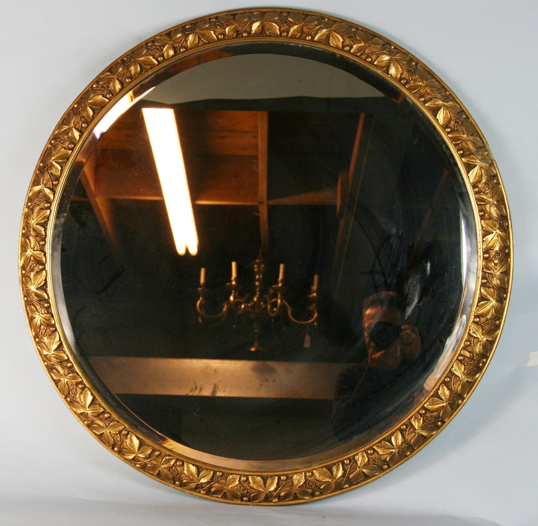 3-810 French beveled glass gilt foliate mirror.