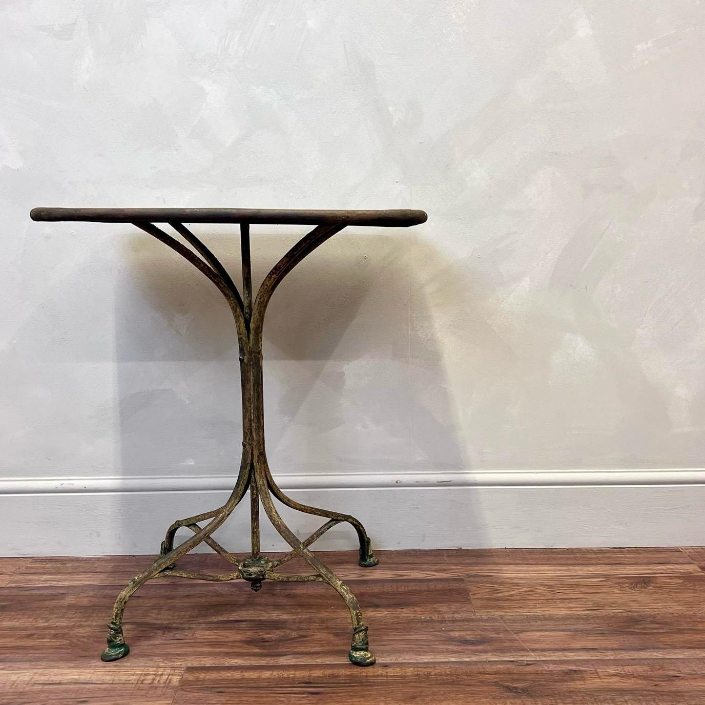 French Bistro Table with wonderful orignal green scraped paint and splayed out legs.
Very sturdy, with no wear holes to the top.
Attributed to the Arras bistro tables of this era.
Would work inside or outside of the home 

France c1900.

Height -