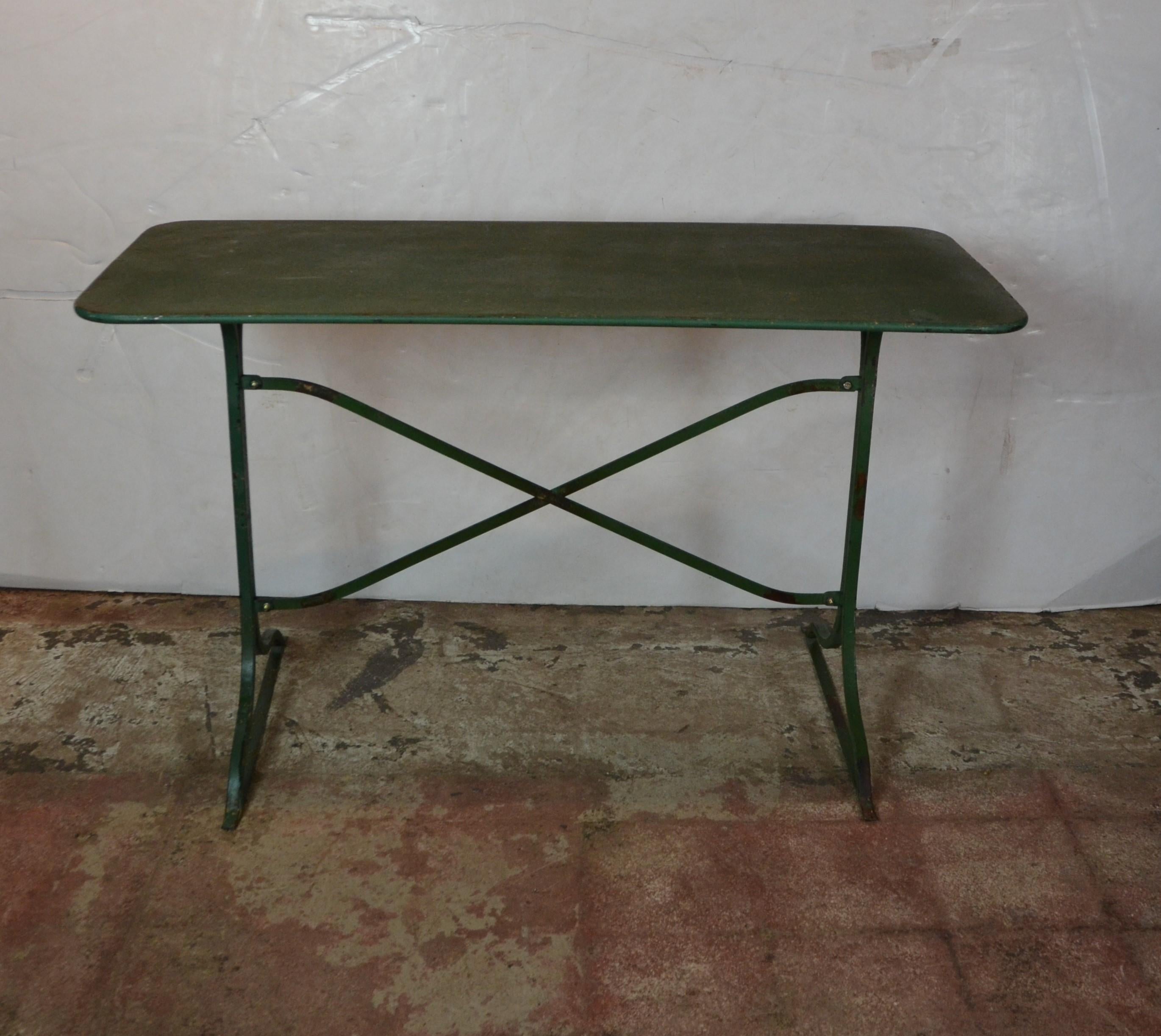 Elegantly fluted cast metal double-pedestal base with steel supports and nicely aged original green paint finish.
