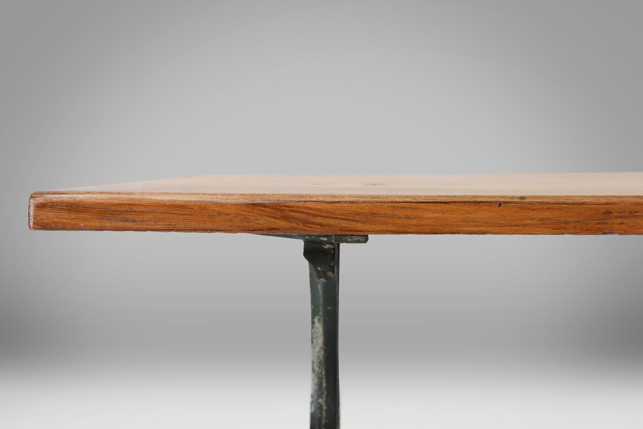 Metal French bistro table with elegant metal base and oak top, ca. 1890 For Sale