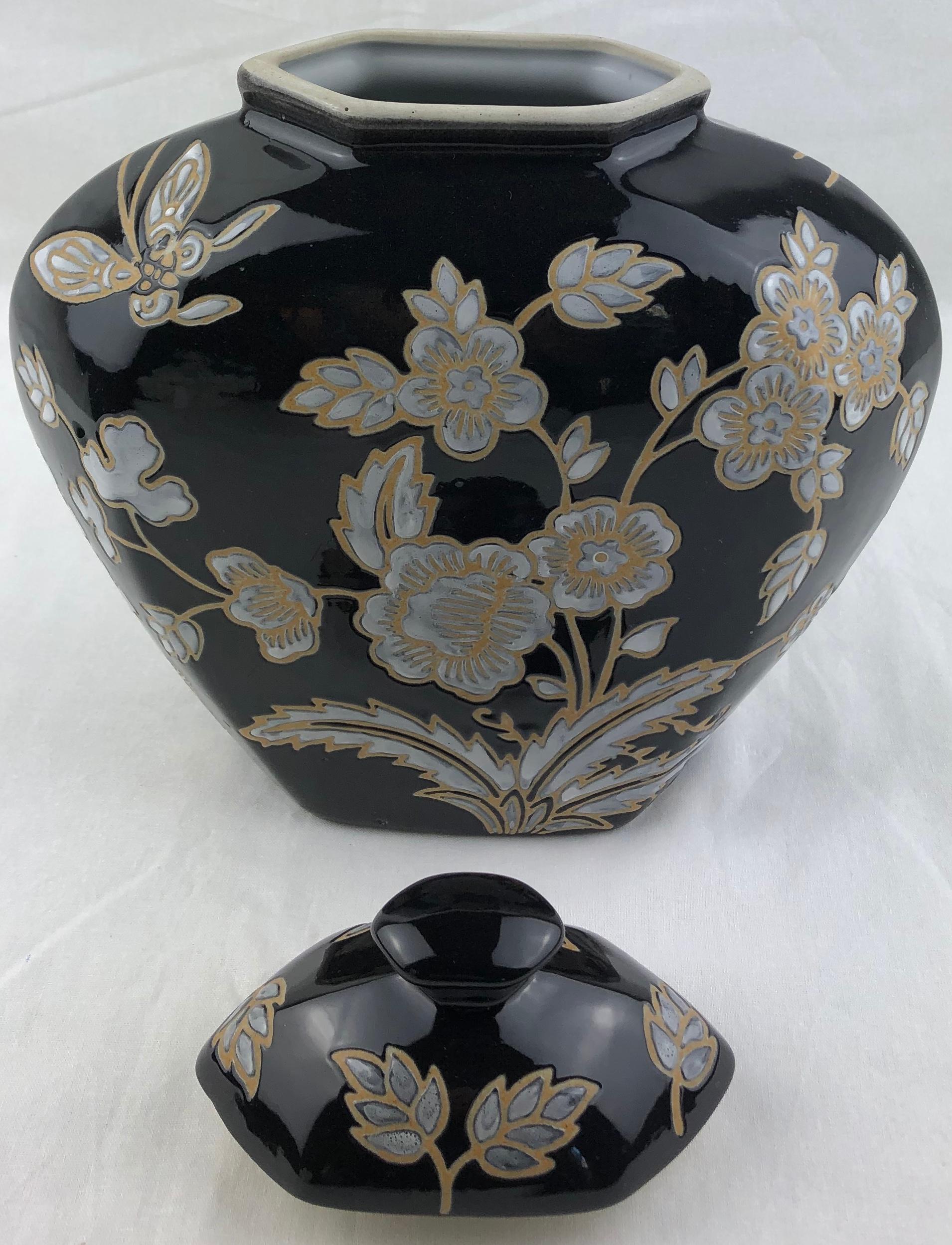 20th Century French Black and Antique White Majolica Lidded Jar with Molded Floral Decor For Sale