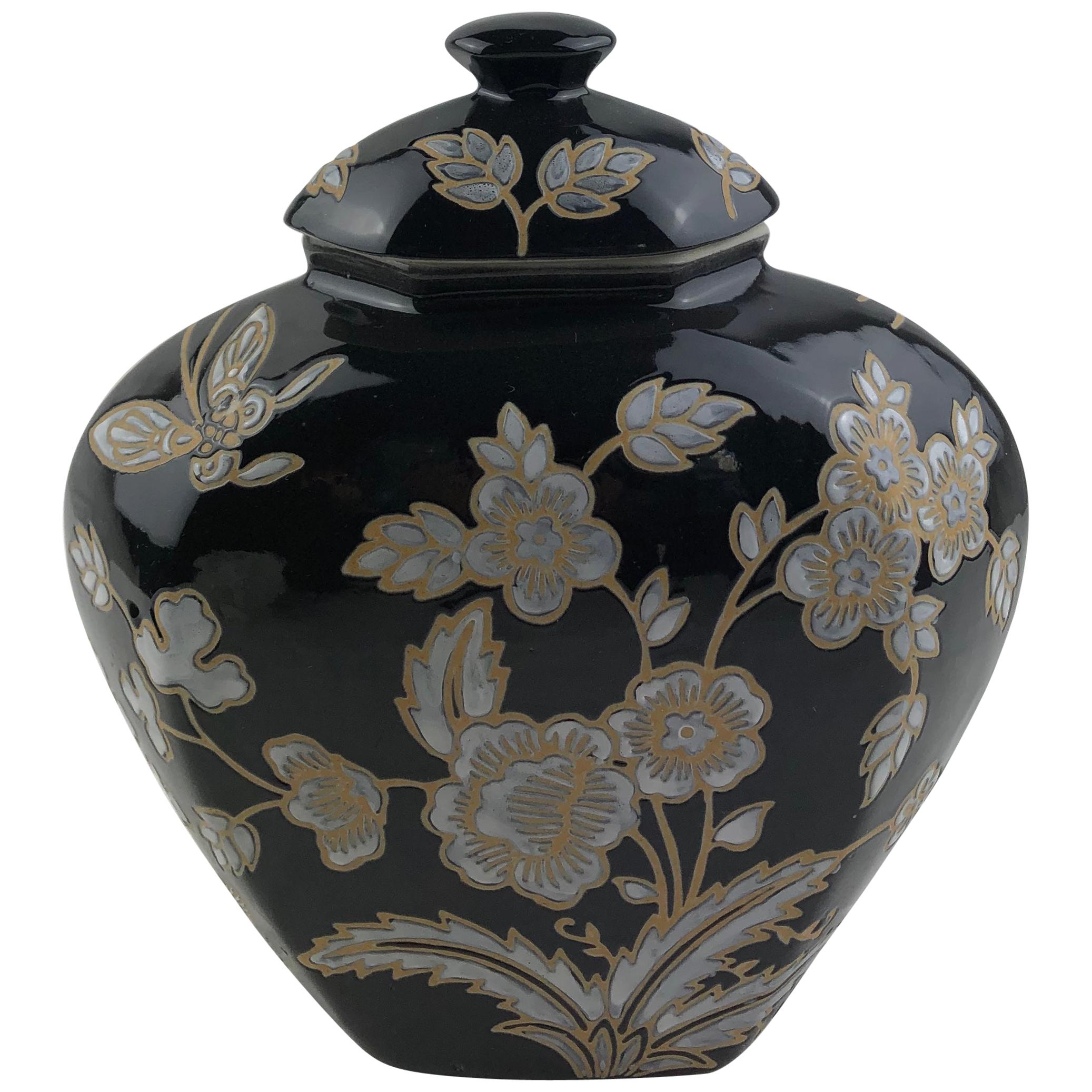 French Black and Antique White Majolica Lidded Jar with Molded Floral Decor For Sale