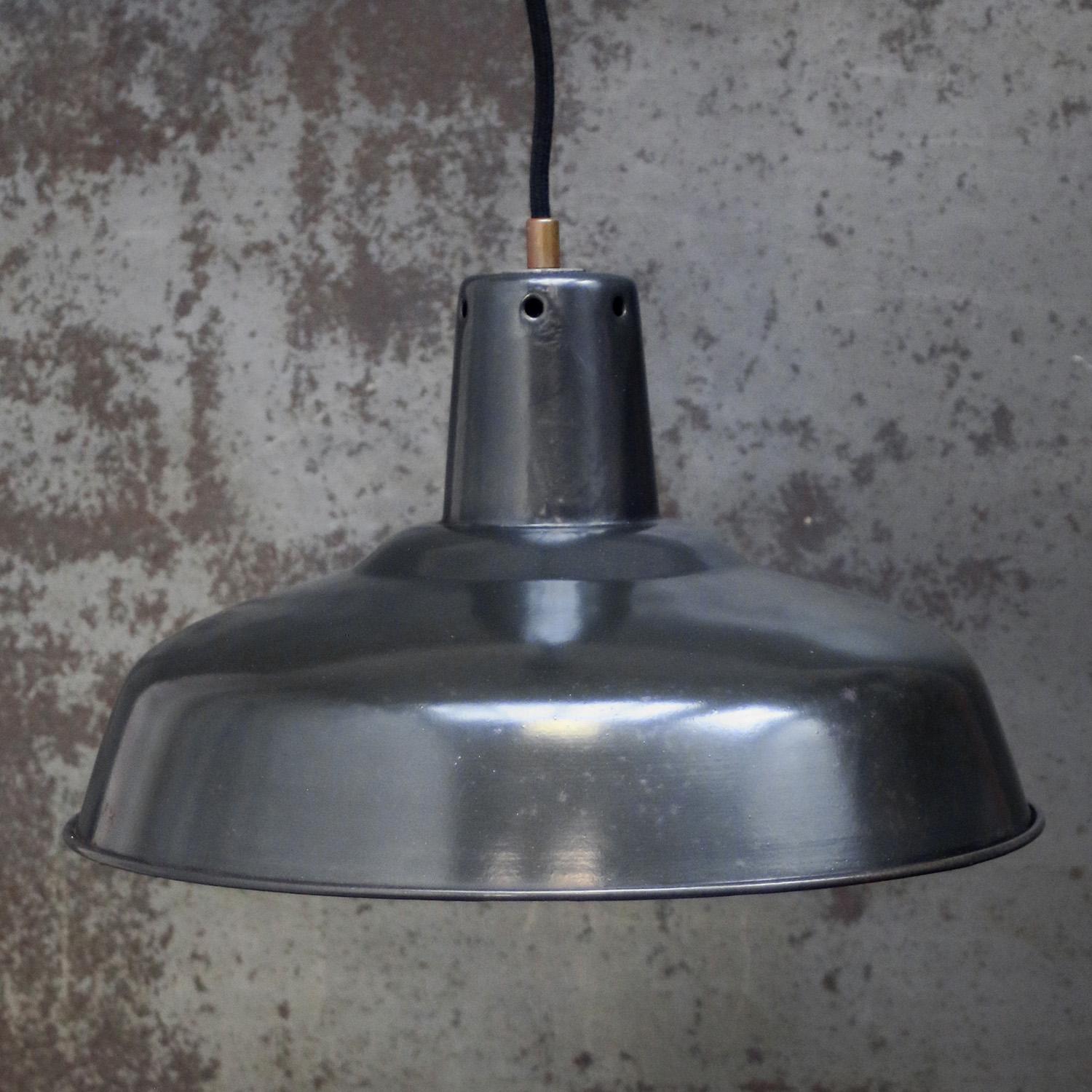 French factory pendant light
Anthracite enamel, white interior

Weight: 1.20 kg / 2.6 lb

Priced per individual item. All lamps have been made suitable by international standards for incandescent light bulbs, energy-efficient and LED bulbs. E26/E27