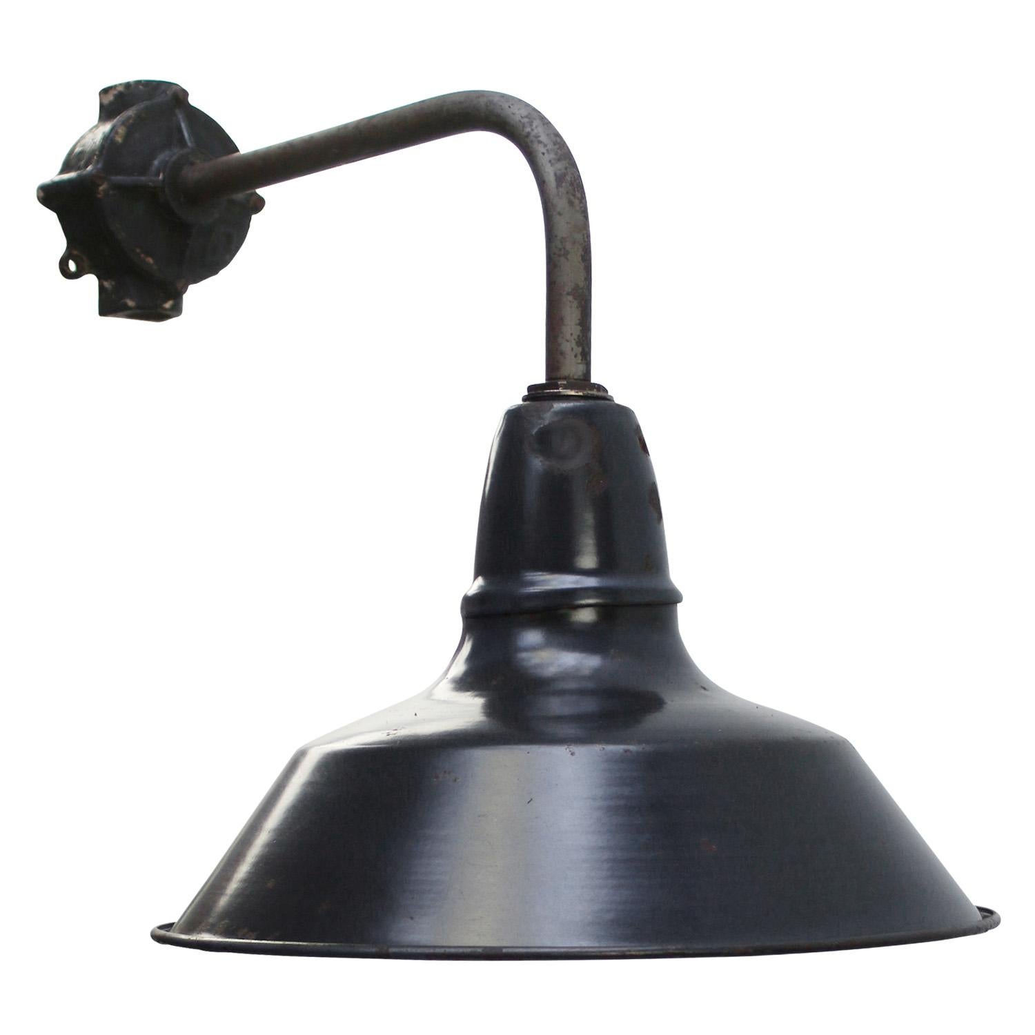 French factory wall light
black / dark blue enamel, white type, white interior

diameter cast iron wall piece: 9 cm, 2 holes to secure

Weight: 1.80 kg / 4 lb

Priced per individual item. All lamps have been made suitable by international standards