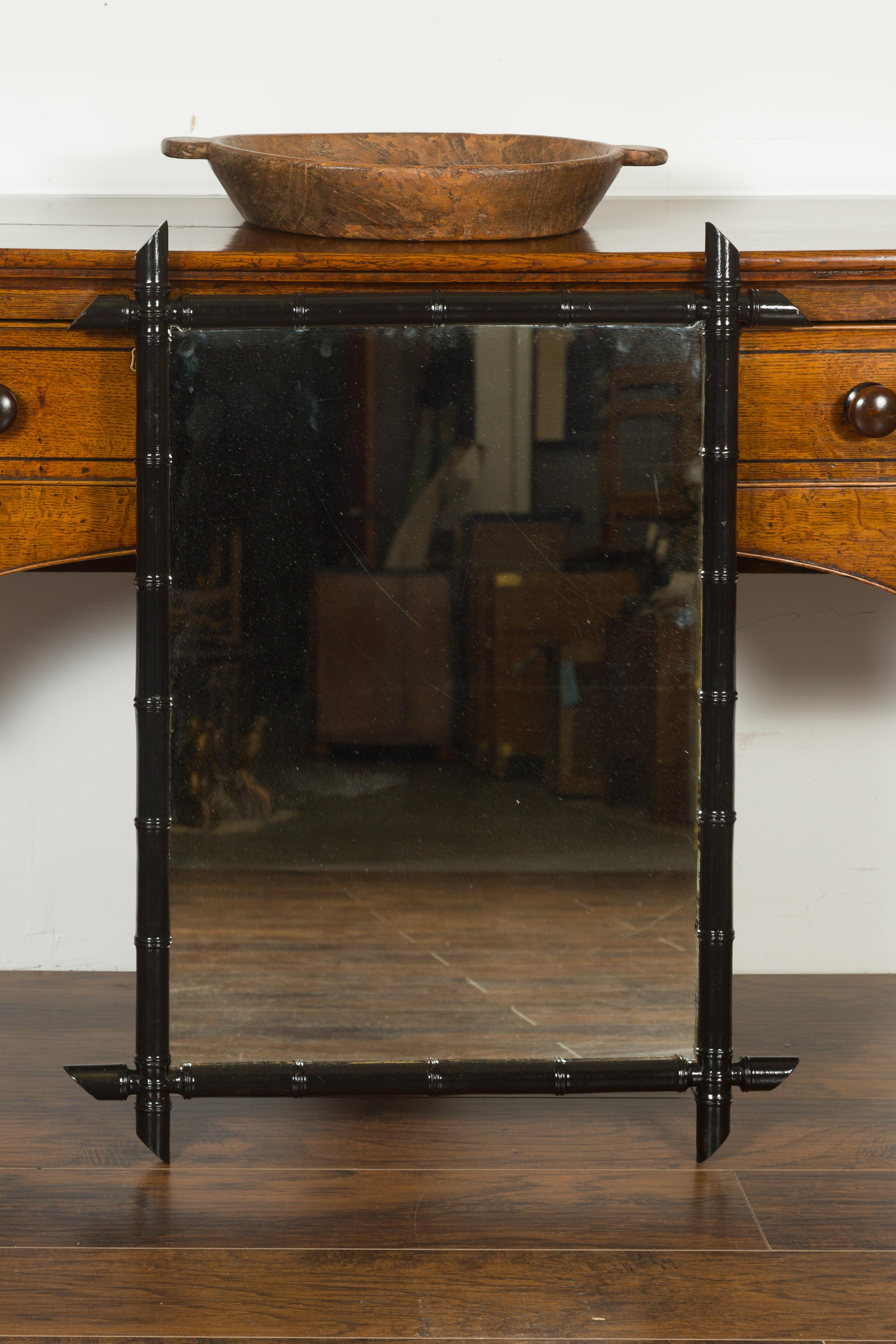 Rustic French Black Ebonized Faux Bamboo Mirror with Protruding Corners, circa 1920