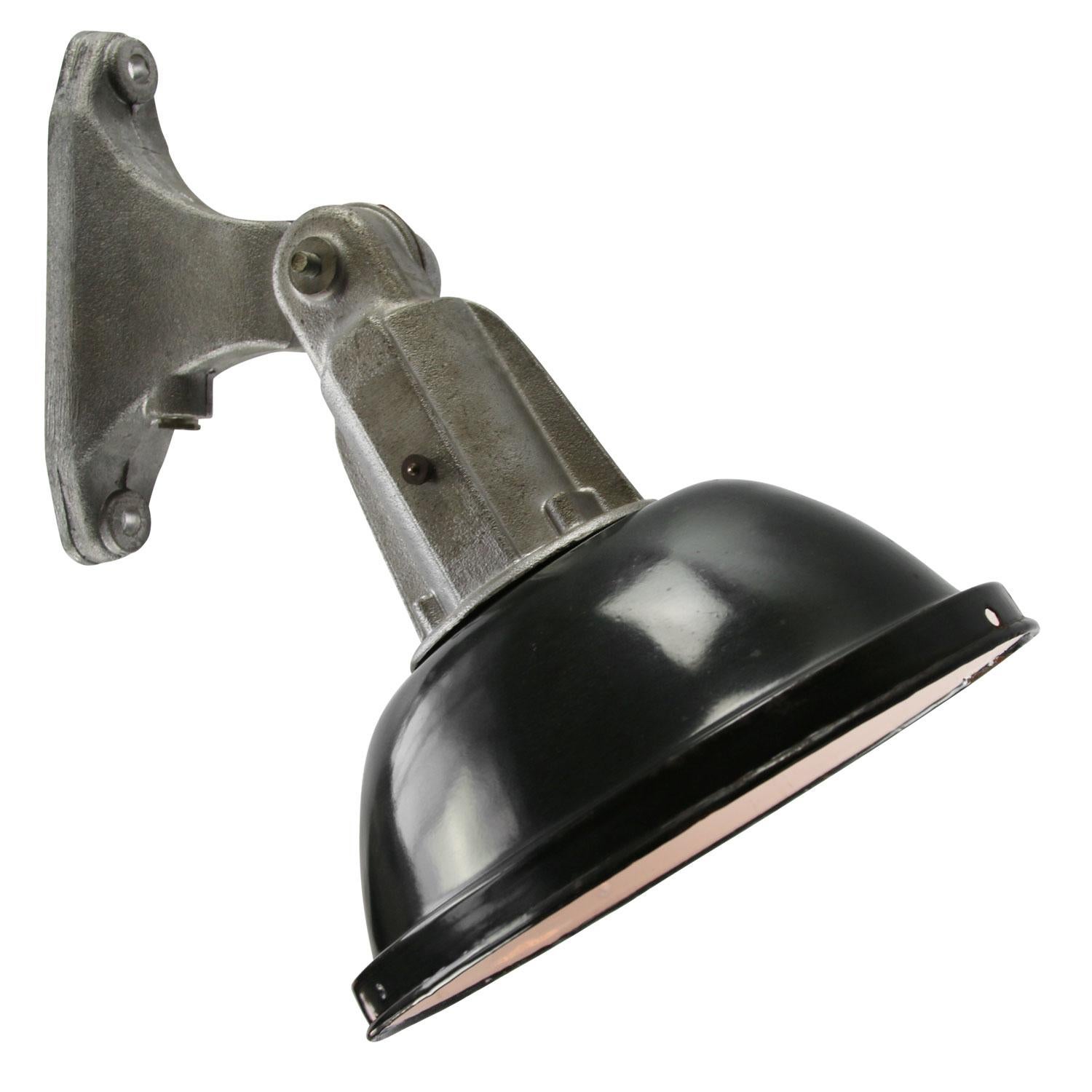 Vintage French Factory wall light
Oval black enamel shade with white interior. Cast aluminum

Weight: 2.00 kg / 4.4 lb

Priced per individual item. All lamps have been made suitable by international standards for incandescent light bulbs,