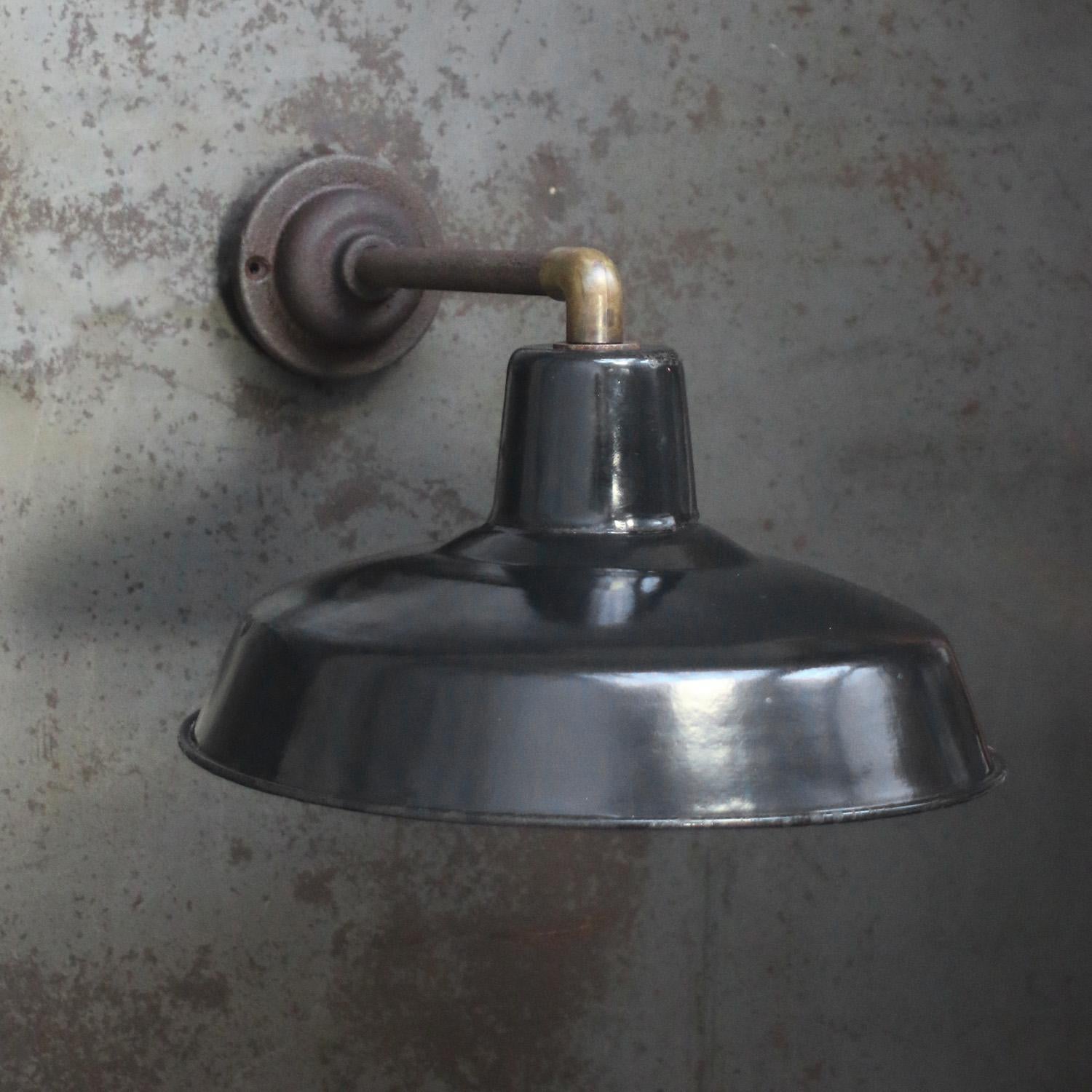 Factory wall light.
Black enamel shade, cast iron arm and wall plate

diameter cast iron wall piece: 10.5 cm / 4” - 2 holes to secure

Weight: 1.90 kg / 4.2 lb

Priced per individual item. All lamps have been made suitable by international standards